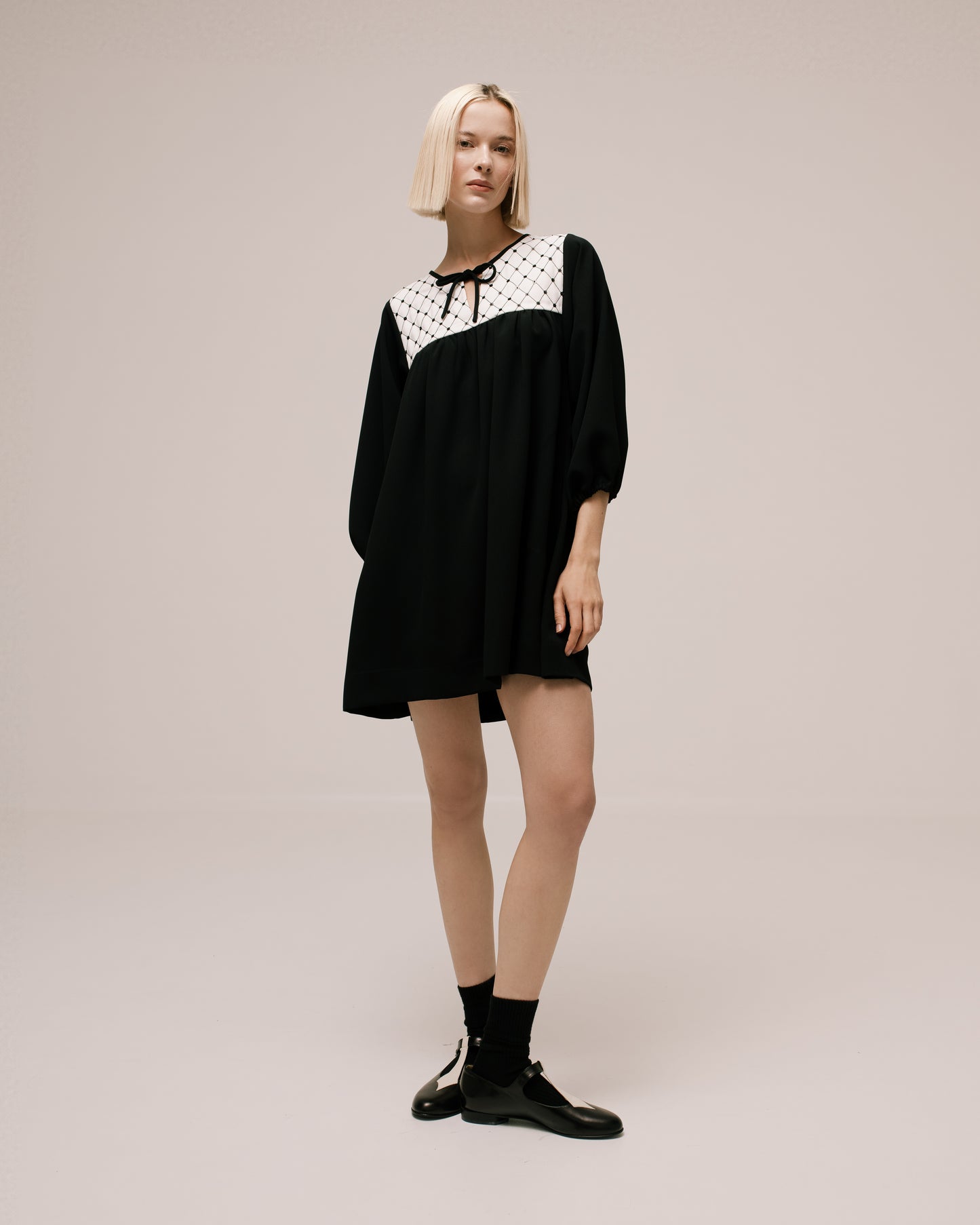 Product still of the Amelia Toro Quilted-Front Puff-Sleeve Cady Mini Dress in Black on a white background