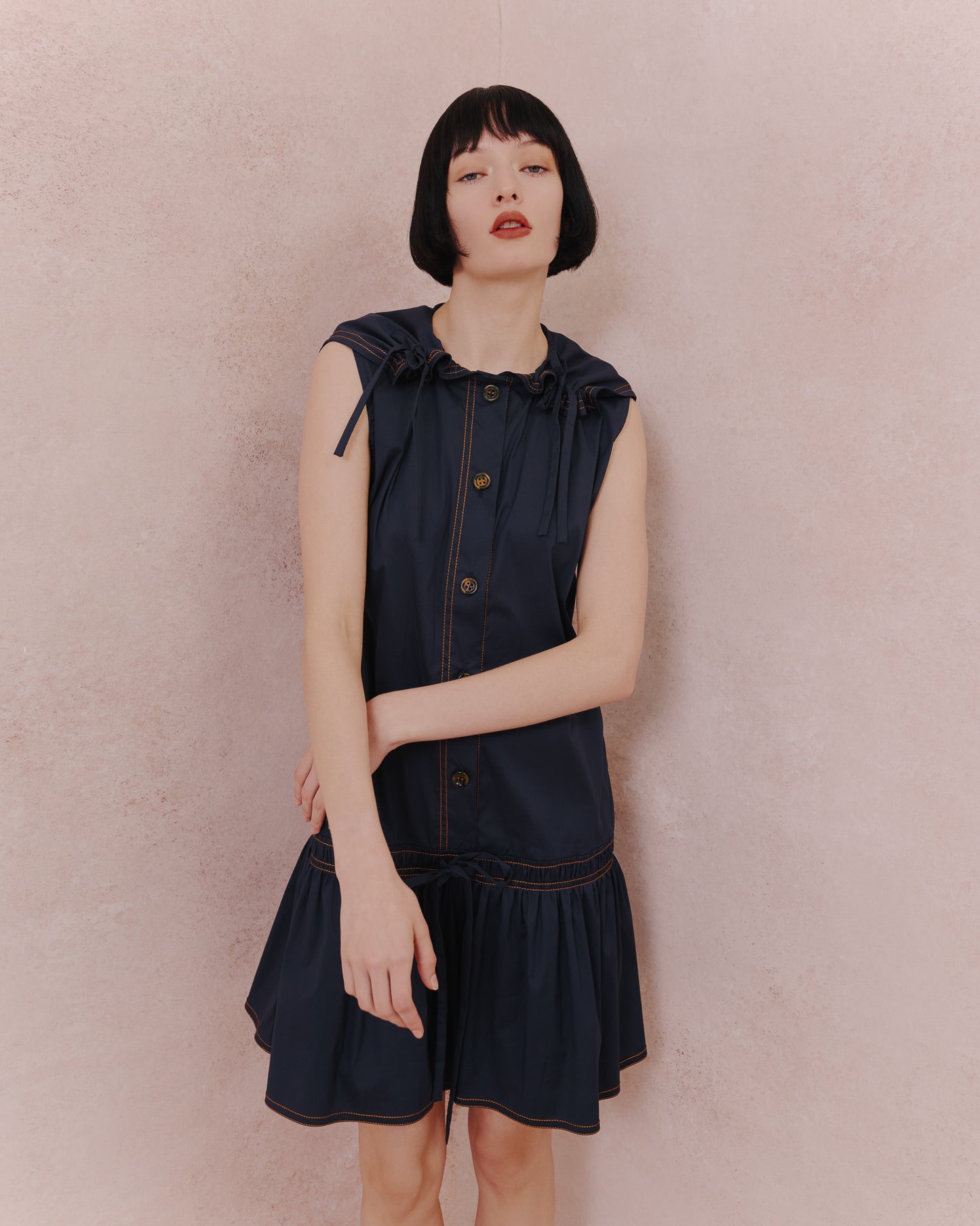 Model wears the Amelia Toro Retro Sailor Cotton Dress in blue, front view