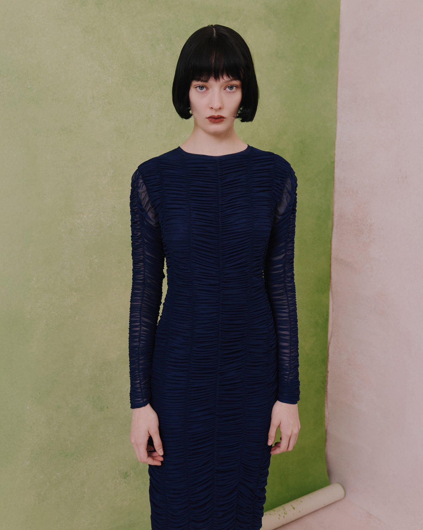 Model wears the Amelia Toro Ruched Tulle Midi Dress in blue, front view