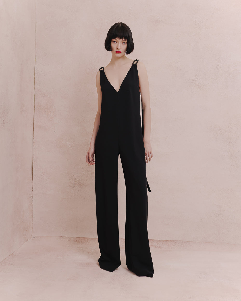 Model wears the Amelia Toro 1920s-Inspired Jumpsuit in black, front view