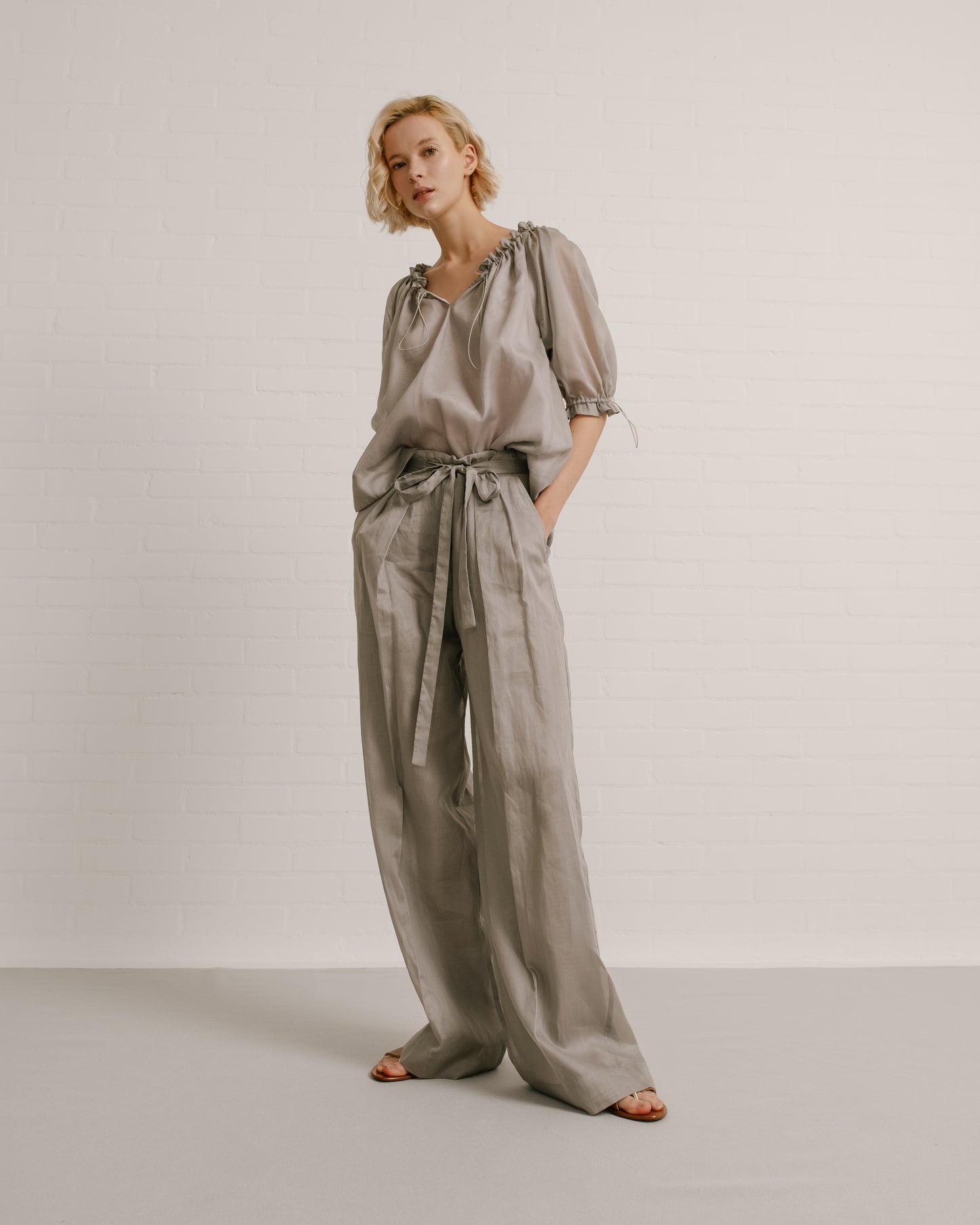 Model wears the Amelia Toro Balloon-Sleeve Cotton Voile Top in Grey/Pink, front view