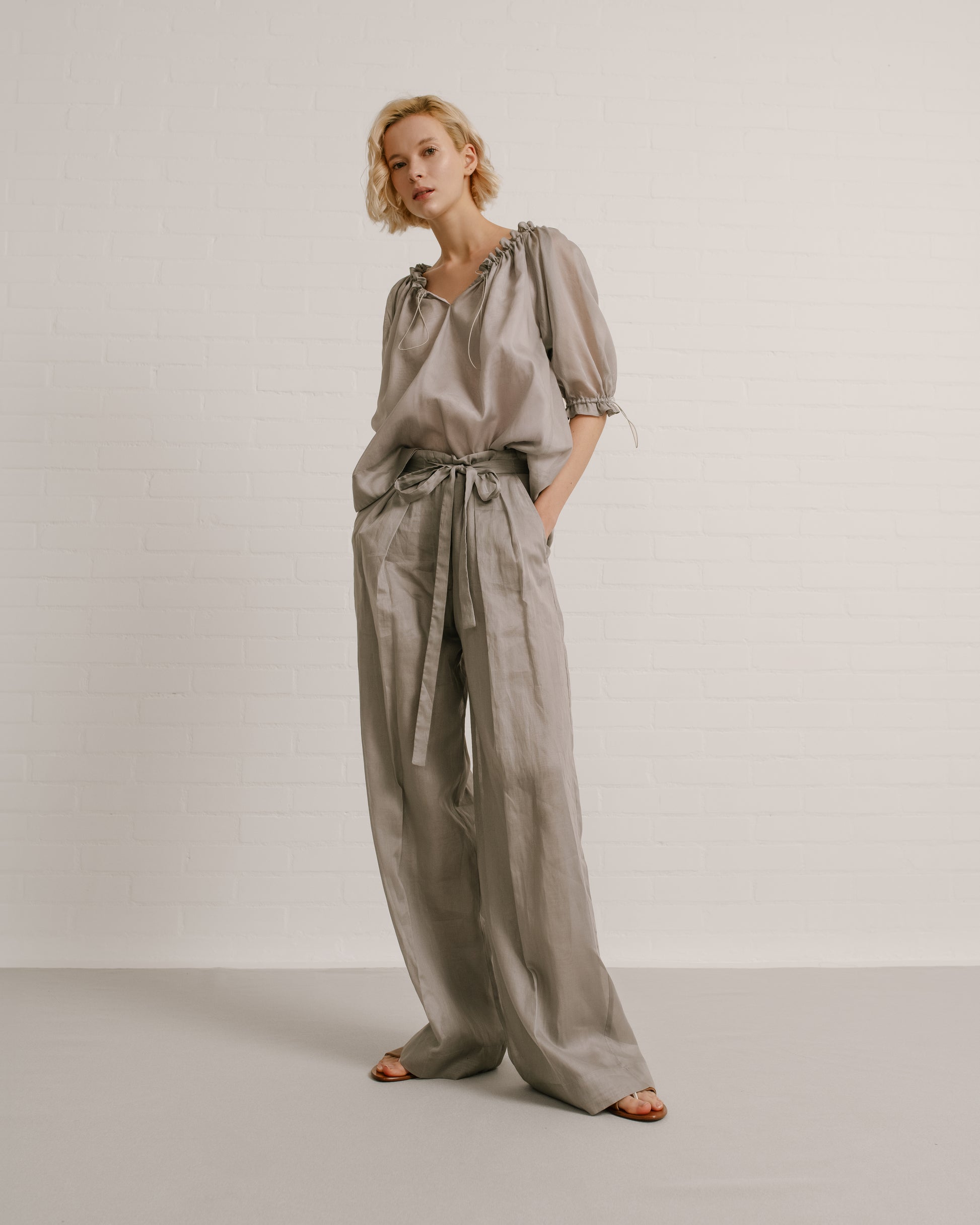 Model wears the Amelia Toro Balloon-Sleeve Cotton Voile Top in Grey/Pink, front view
