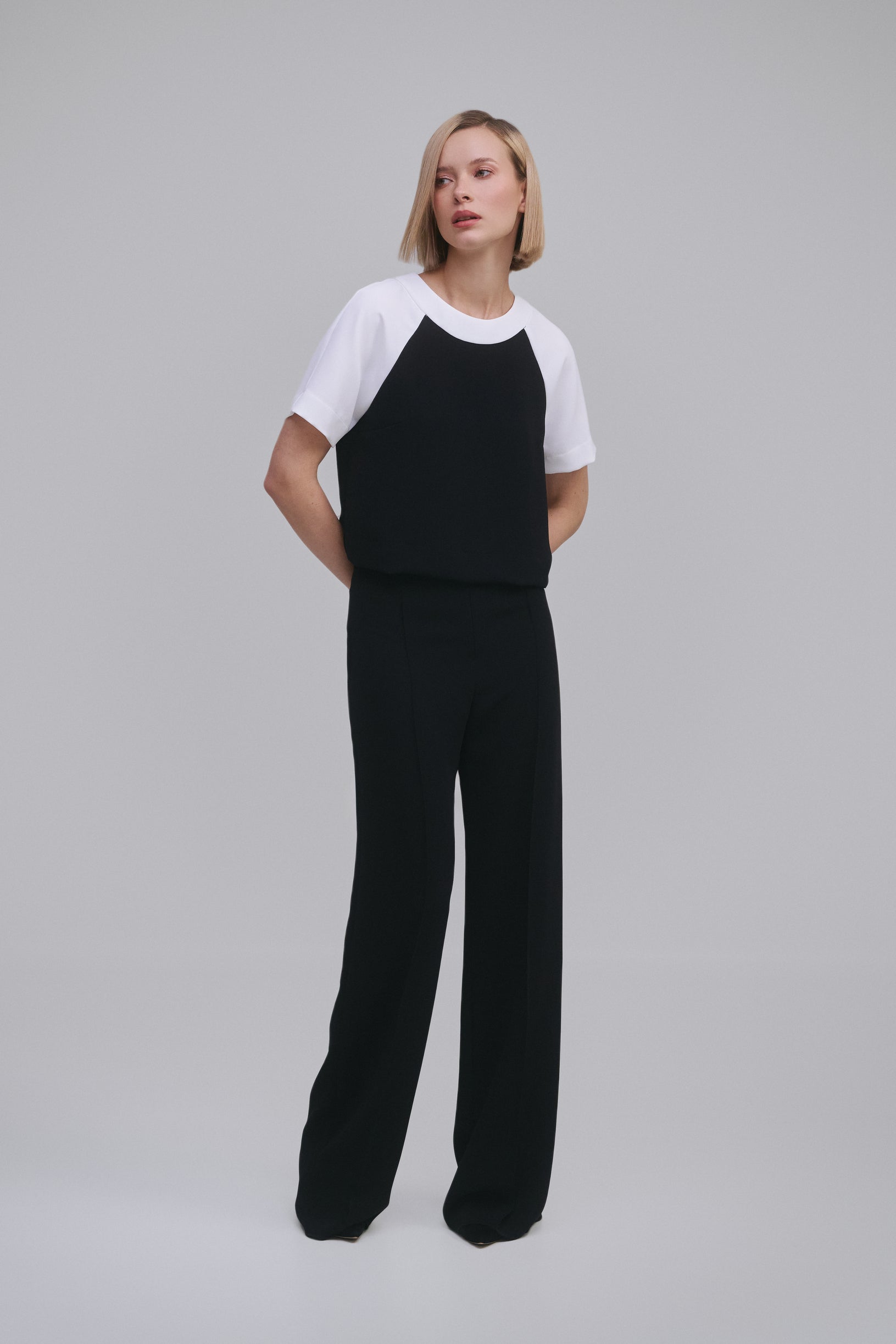 Model wears the Amelia Toro Contrast Raglan-Sleeve Top in Black & White, front view