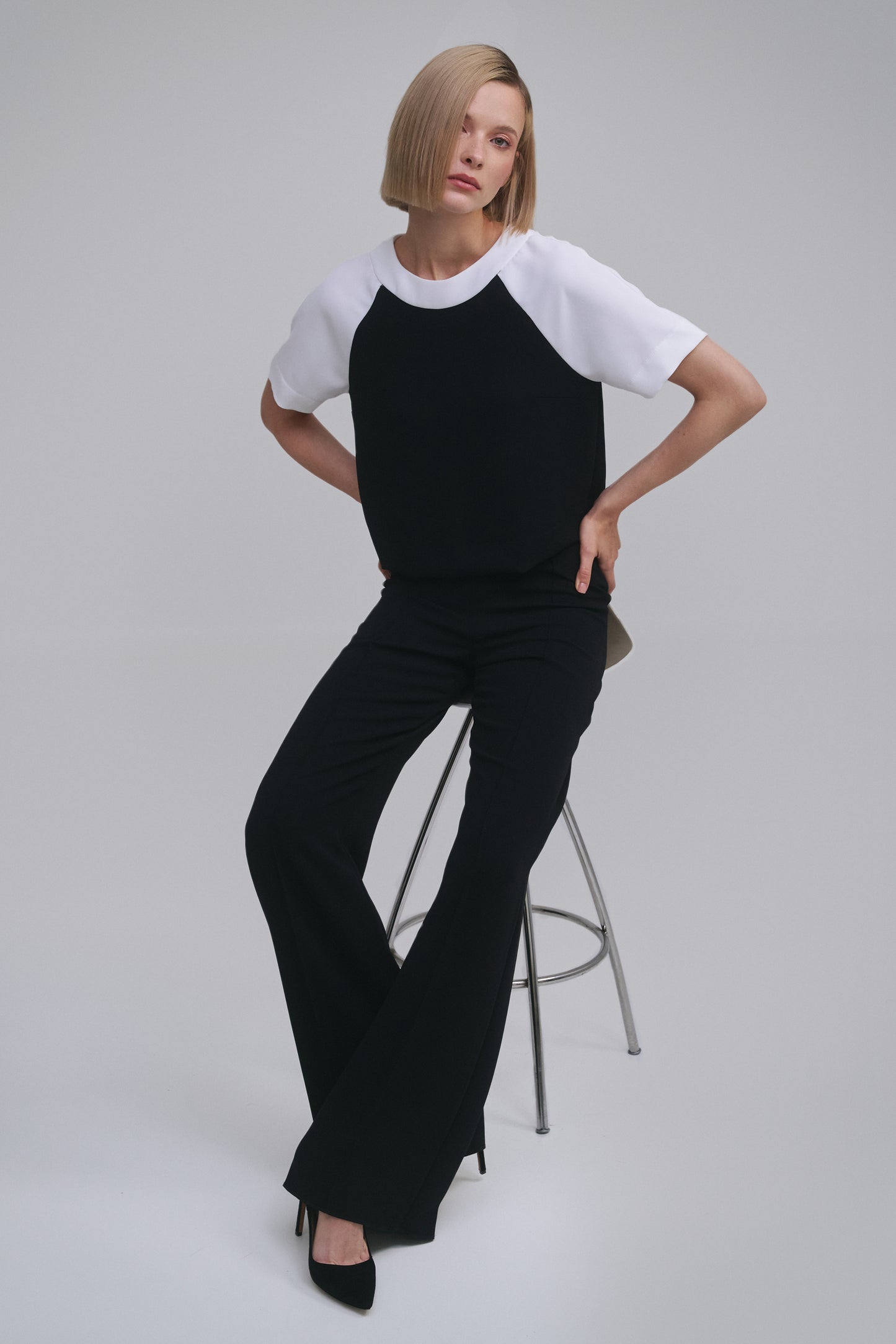 Model wears the Amelia Toro Contrast Raglan-Sleeve Top in Black & White, front view
