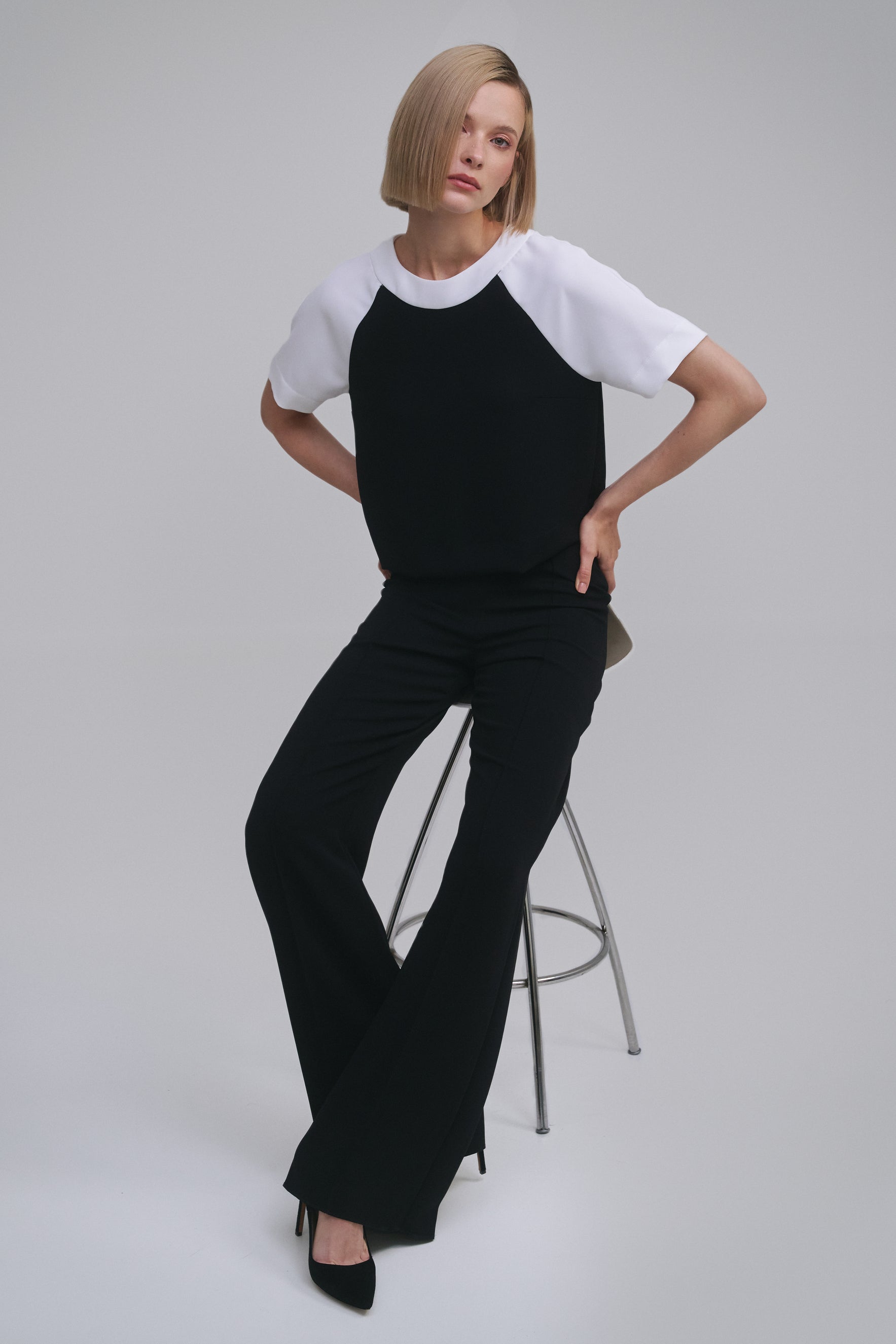 Model wears the Amelia Toro Contrast Raglan-Sleeve Top in Black & White, front view
