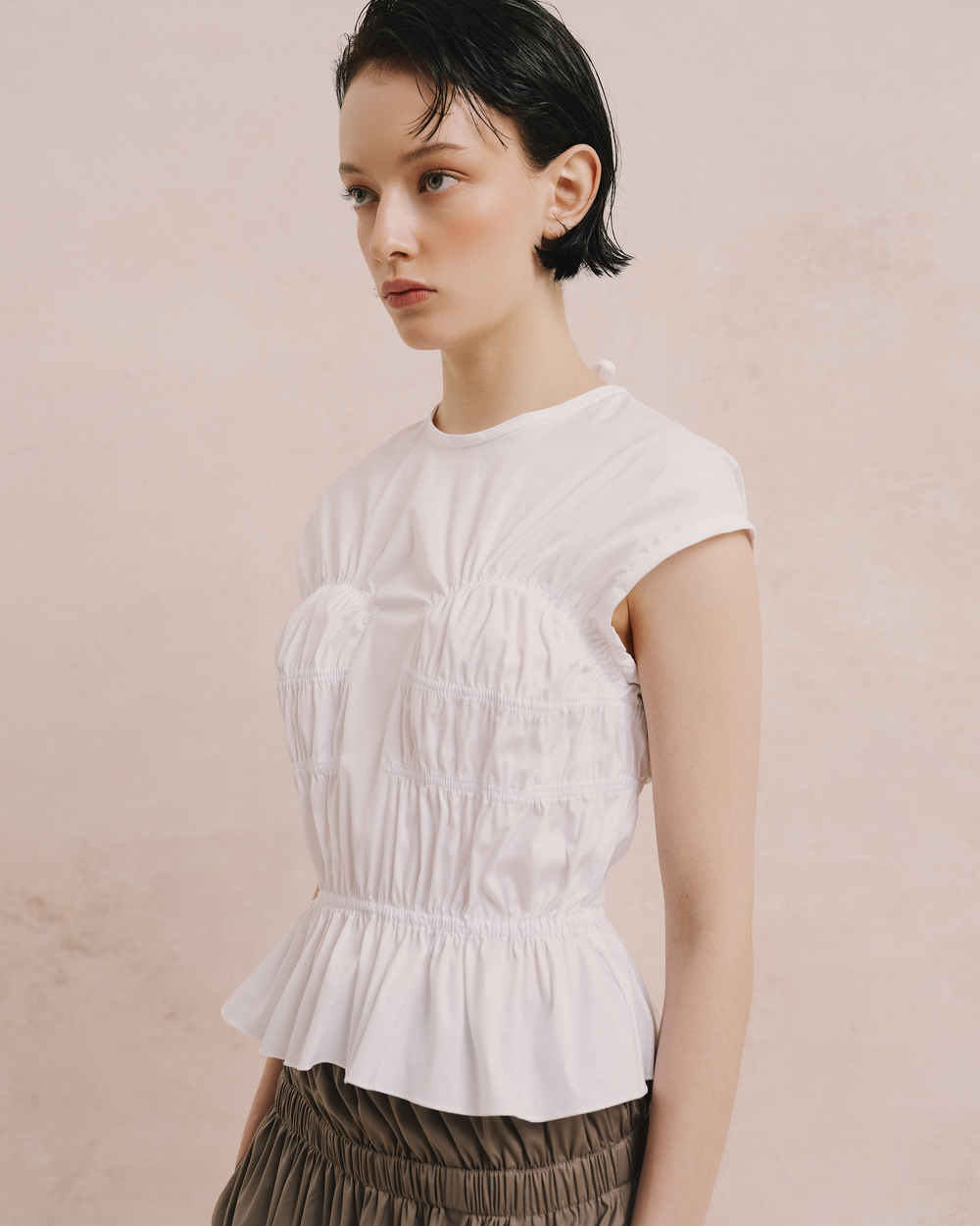 Model wears the Amelia Toro Cotton Gathered Top in white, front view