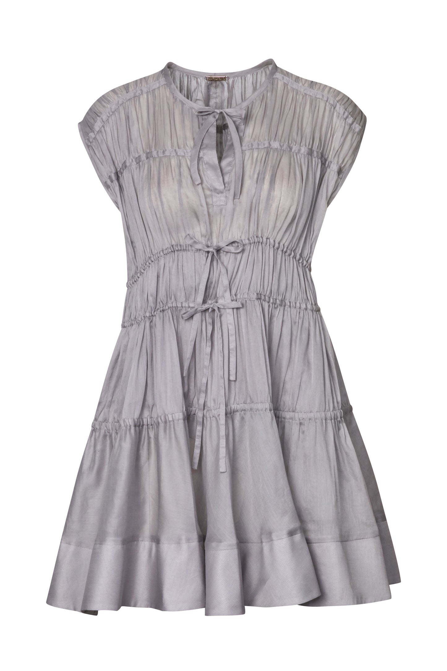 Product still of the Amelia Toro Cotton Voile Tiered Mini Dress in grey on a white background