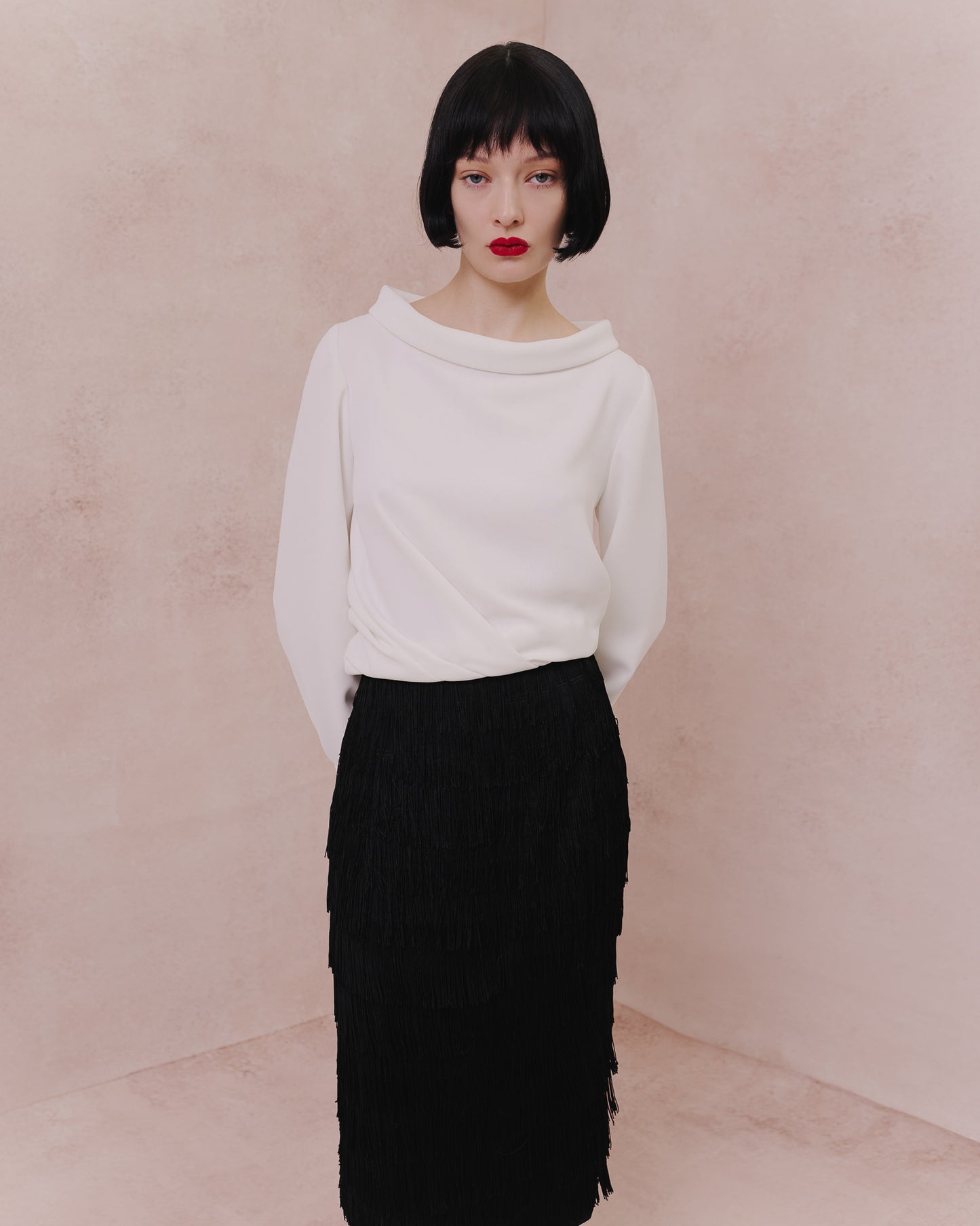 Model wears the Amelia Toro Draped-Waist Long-Sleeve Blouse in white, front view