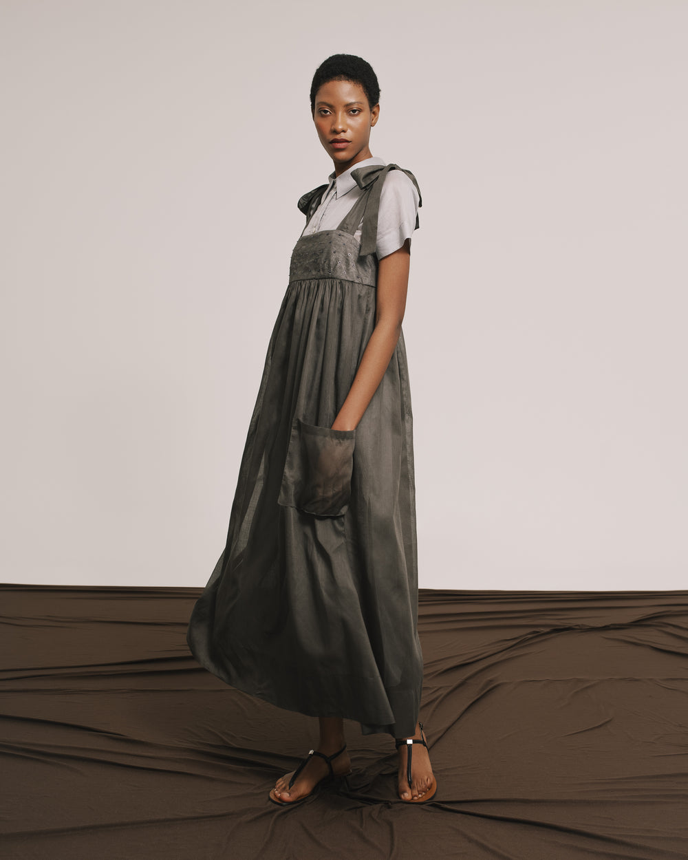 Model wears the Amelia Toro Embroidered Cotton Voile Midi Sundress in Graphite/Grey, front view