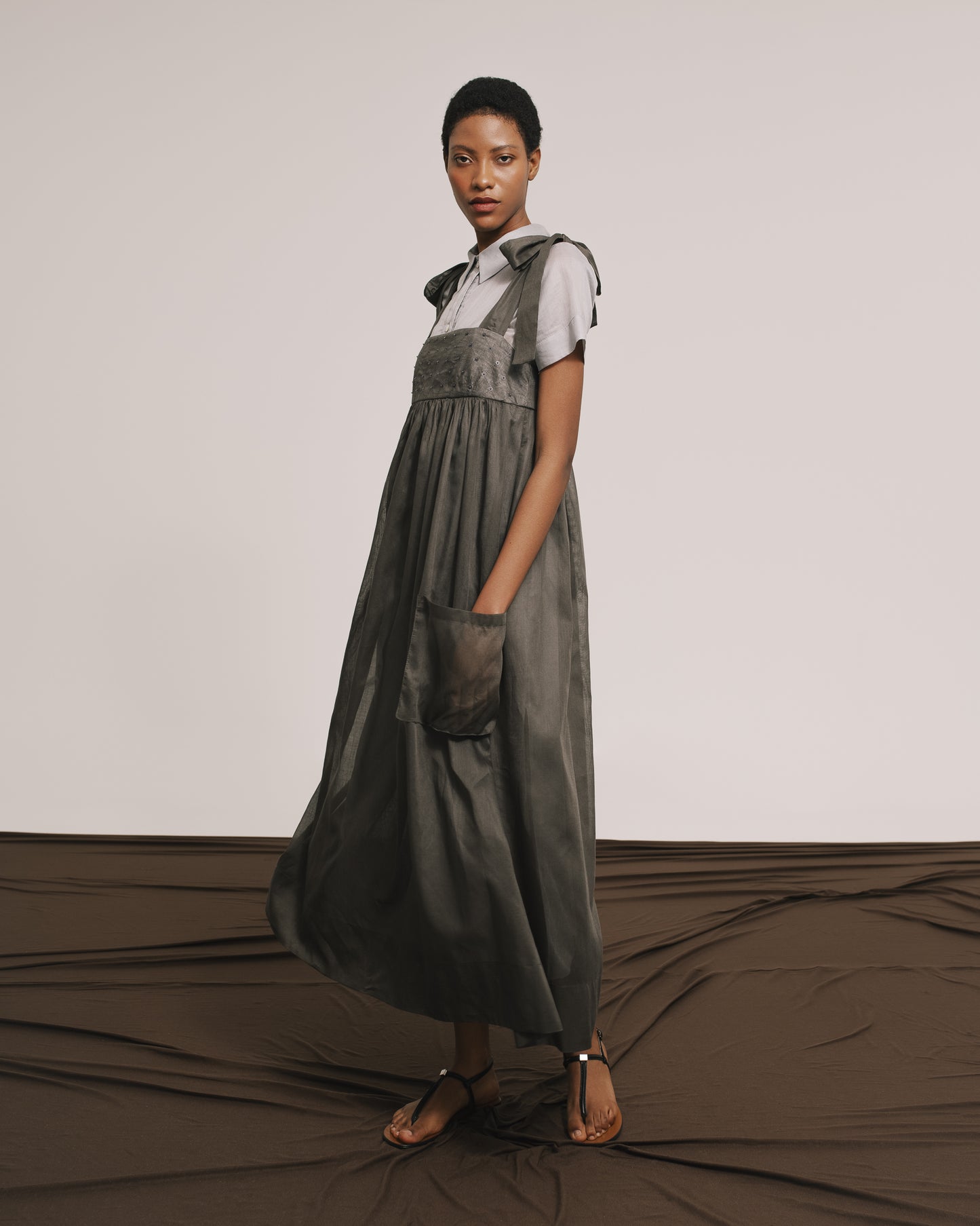 Model wears the Amelia Toro Embroidered Cotton Voile Midi Sundress in Graphite/Grey, front view