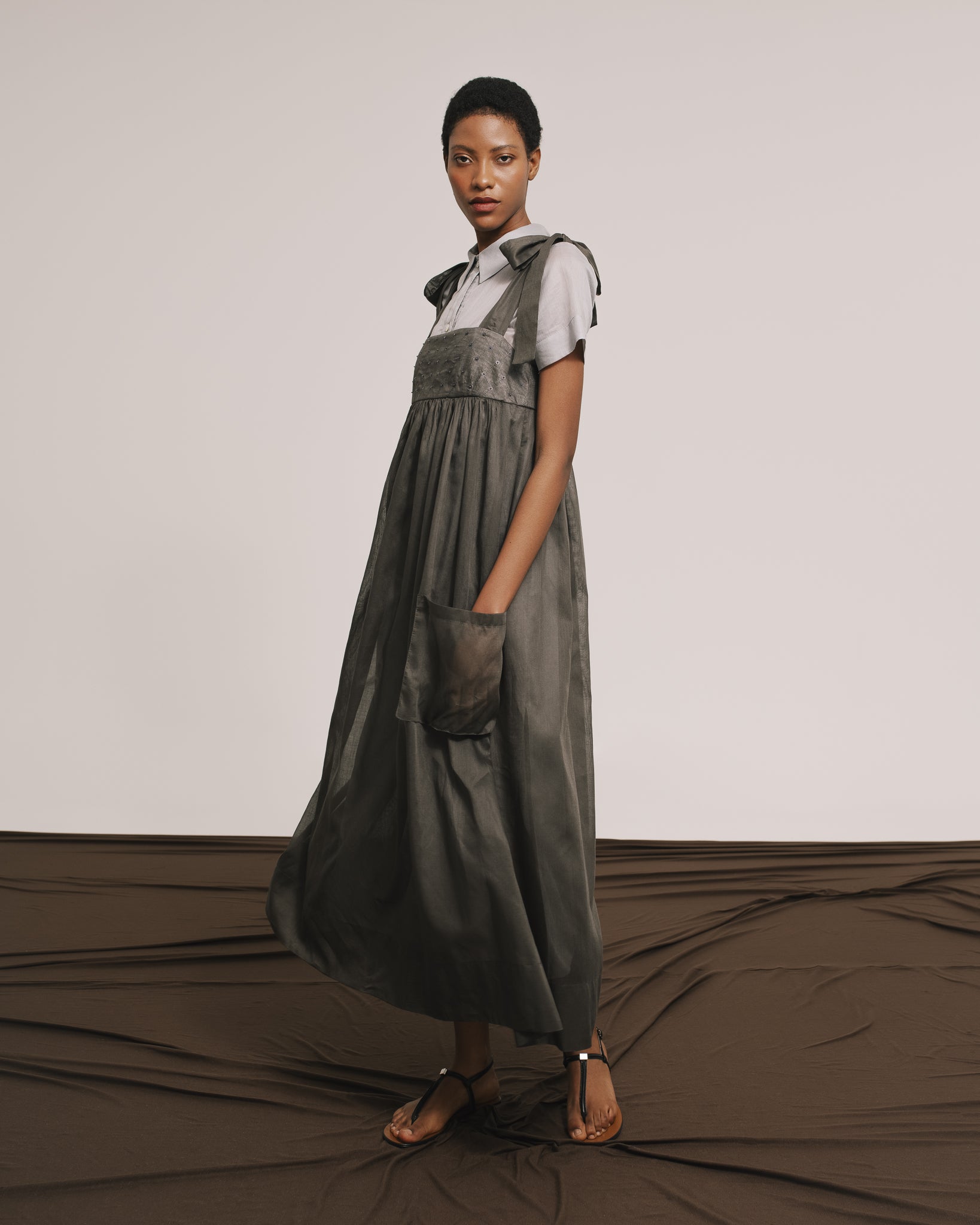 Model wears the Amelia Toro Embroidered Cotton Voile Midi Sundress in Graphite/Grey, front view