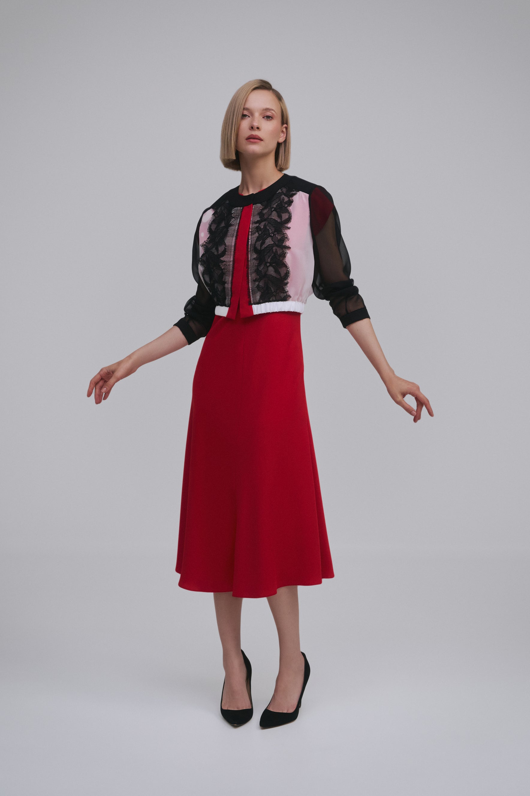 Model wears the Amelia Toro Embroidered Silk Chiffon Bolero Jacket in Black & White, front view
