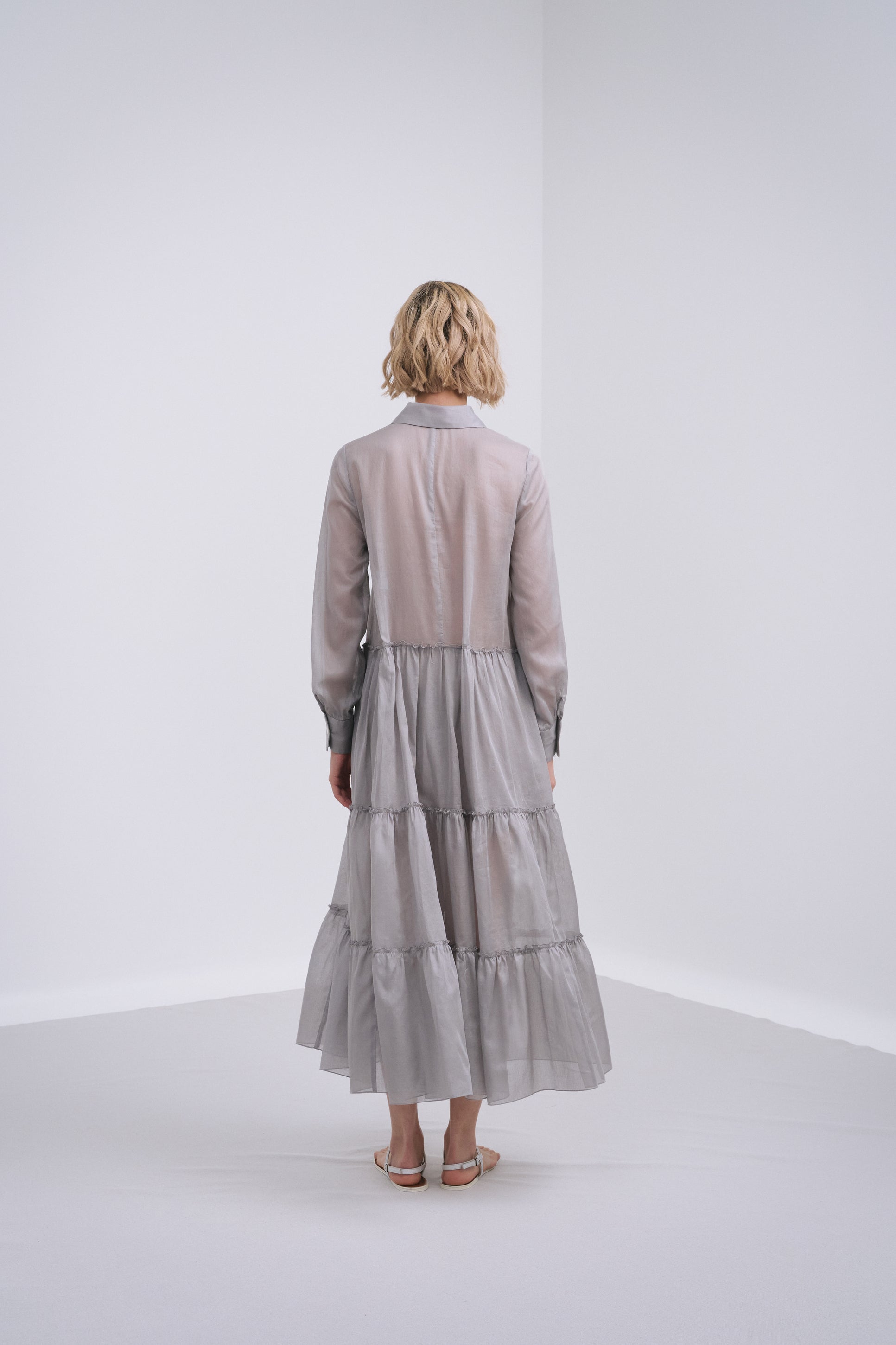 Model wears the Amelia Toro Long-Sleeve Ruffle-Skirt Cotton Voile Midi Dress in Red, front view