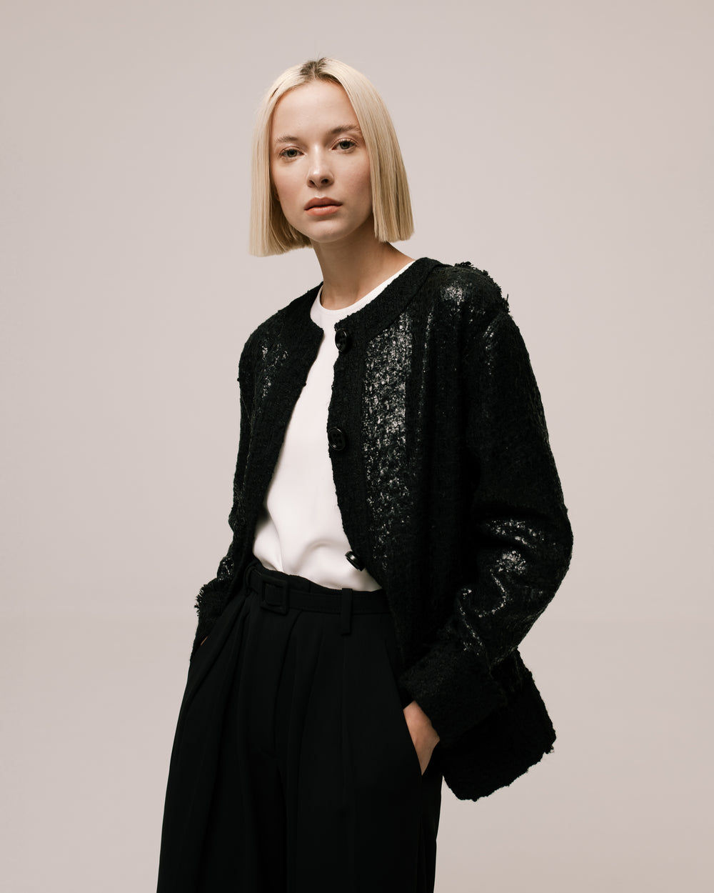 Model wears the Amelia Toro Loose-Fit Contrast Wool Jacket in Black, front view