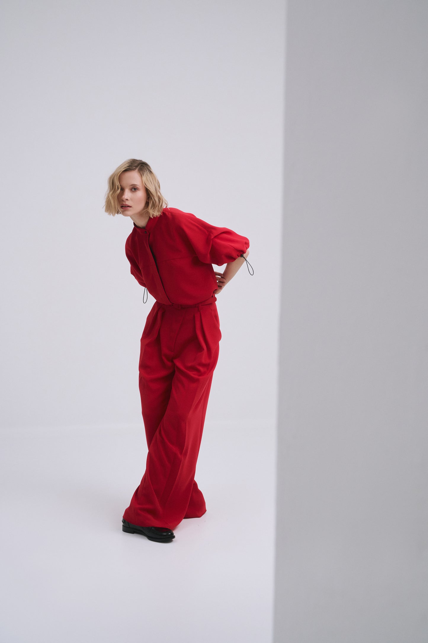 Model wears the Amelia Toro Nehru-Collar Kimono-Sleeve Blouse in White, front view