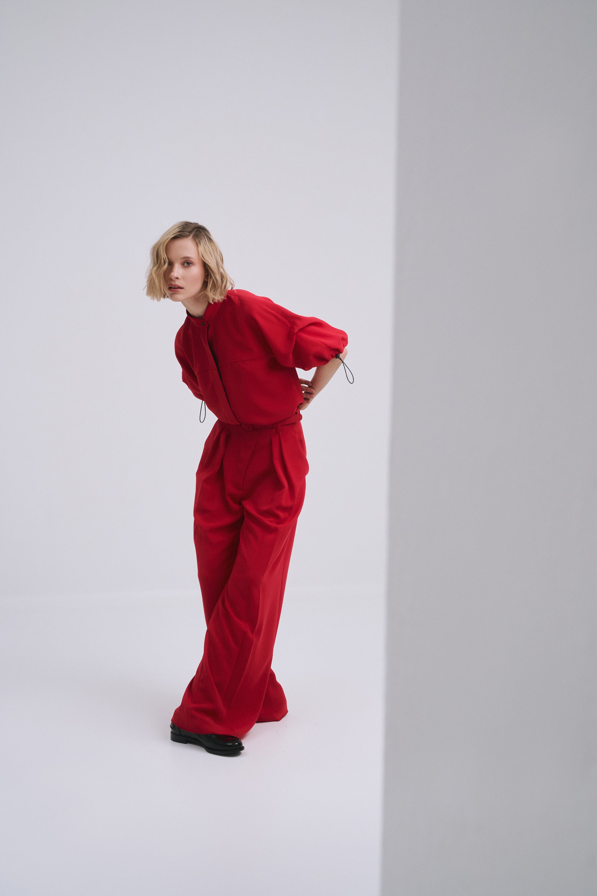 Model wears the Amelia Toro Nehru-Collar Kimono-Sleeve Blouse in White, front view