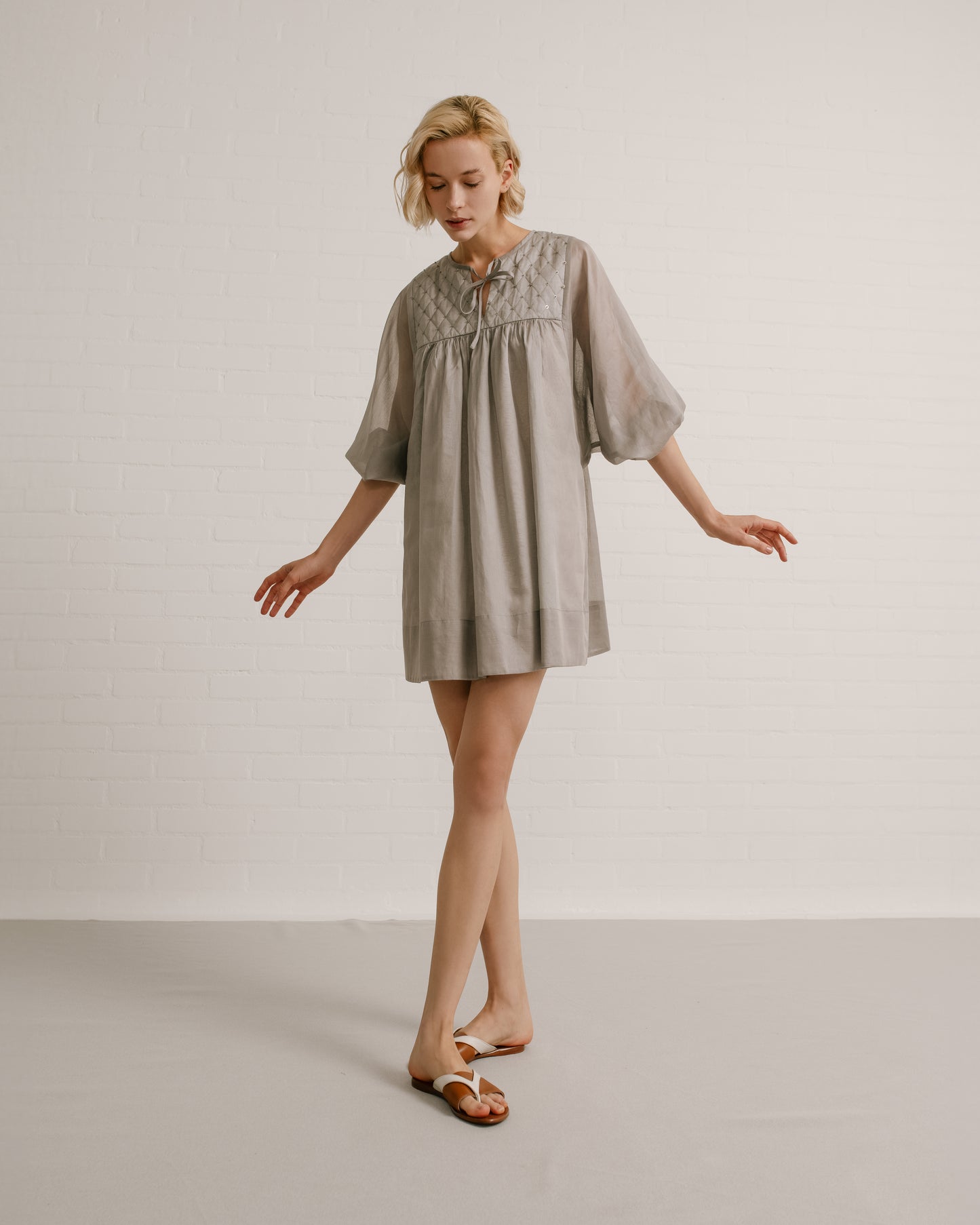 Model wears the Amelia Toro Quilted-Bodice Cotton Voile Mini Dress in Graphite/Grey, front view