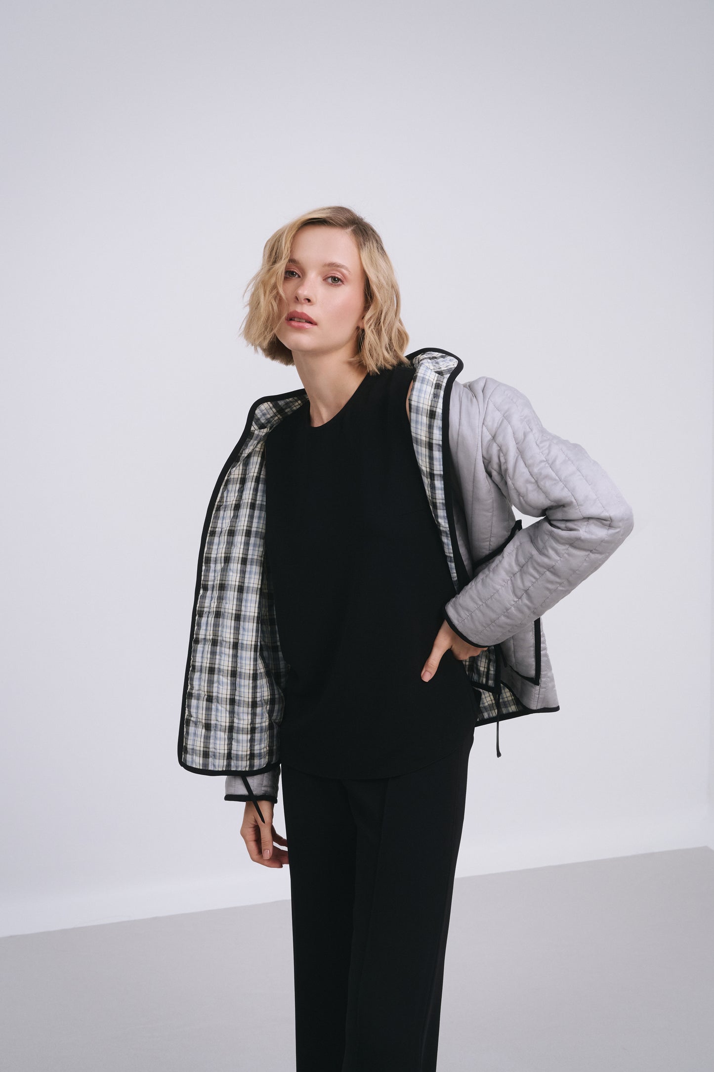 Model wears the Amelia Toro Quilted Cotton Mandarin-Collar Jacket in Gray, front view