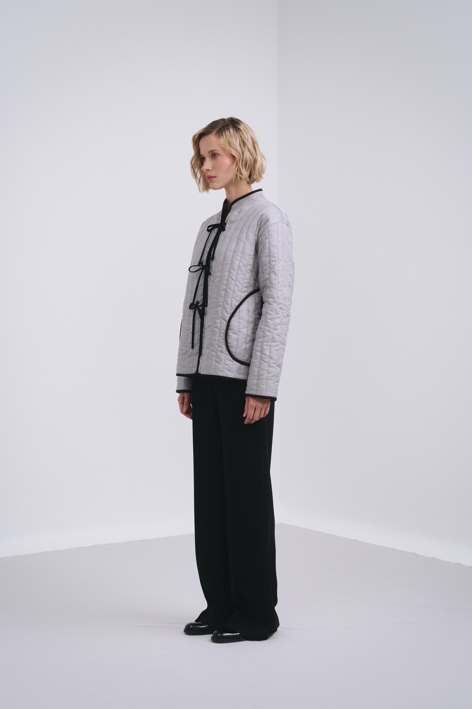 Model wears the Amelia Toro Quilted Cotton Mandarin-Collar Jacket in Gray, front view
