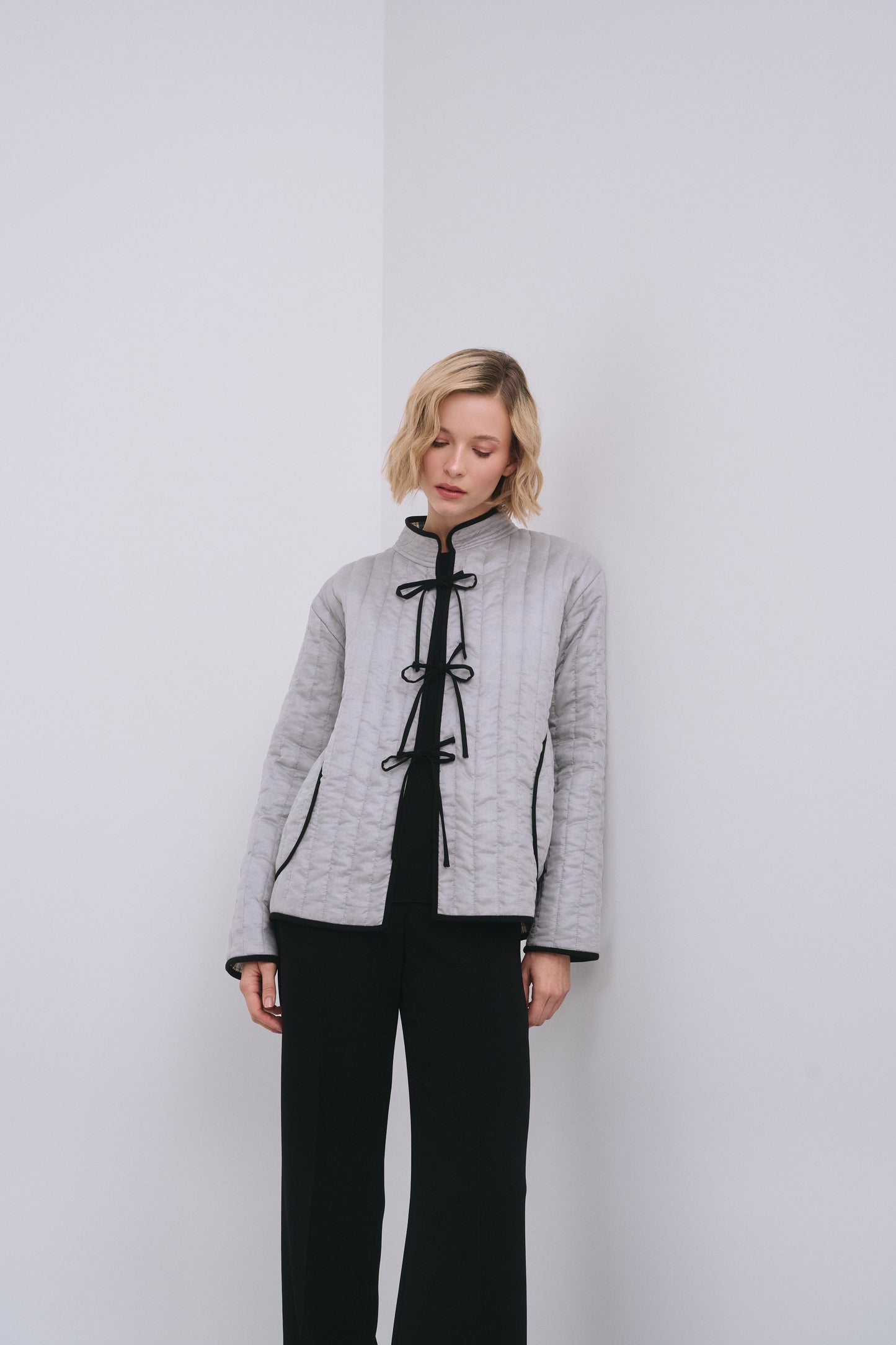 Model wears the Amelia Toro Quilted Cotton Mandarin-Collar Jacket in Gray, front view