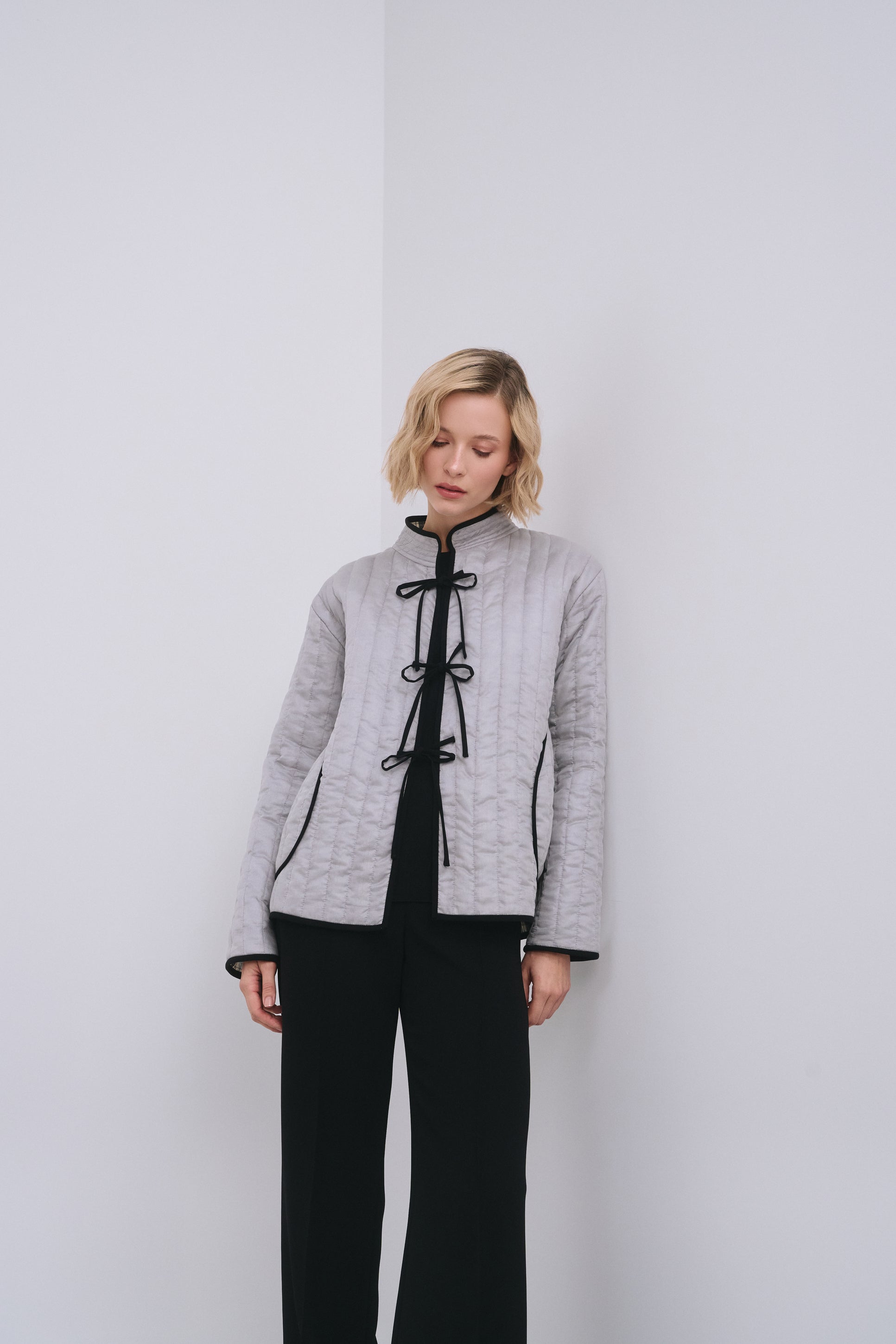 Model wears the Amelia Toro Quilted Cotton Mandarin-Collar Jacket in Gray, front view