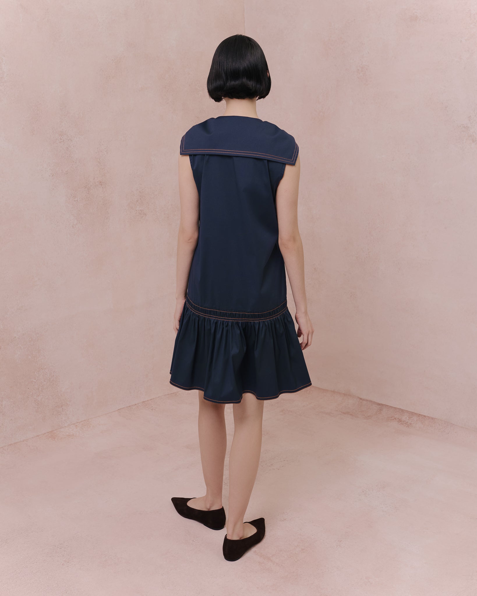 Model wears the Amelia Toro Retro Sailor Cotton Dress in blue, front view