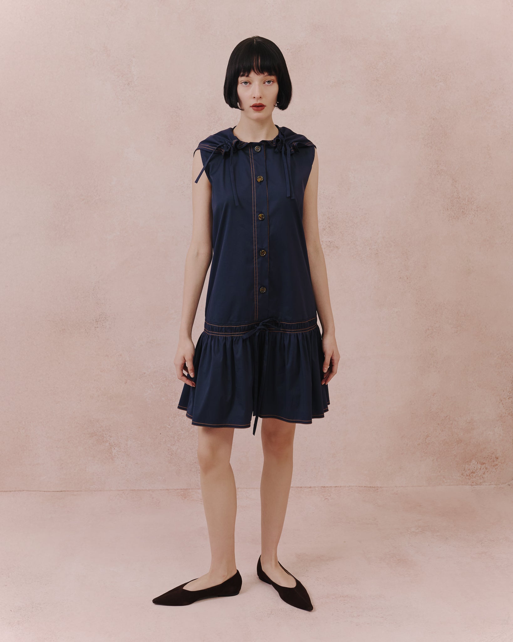 Model wears the Amelia Toro Retro Sailor Cotton Dress in blue, front view