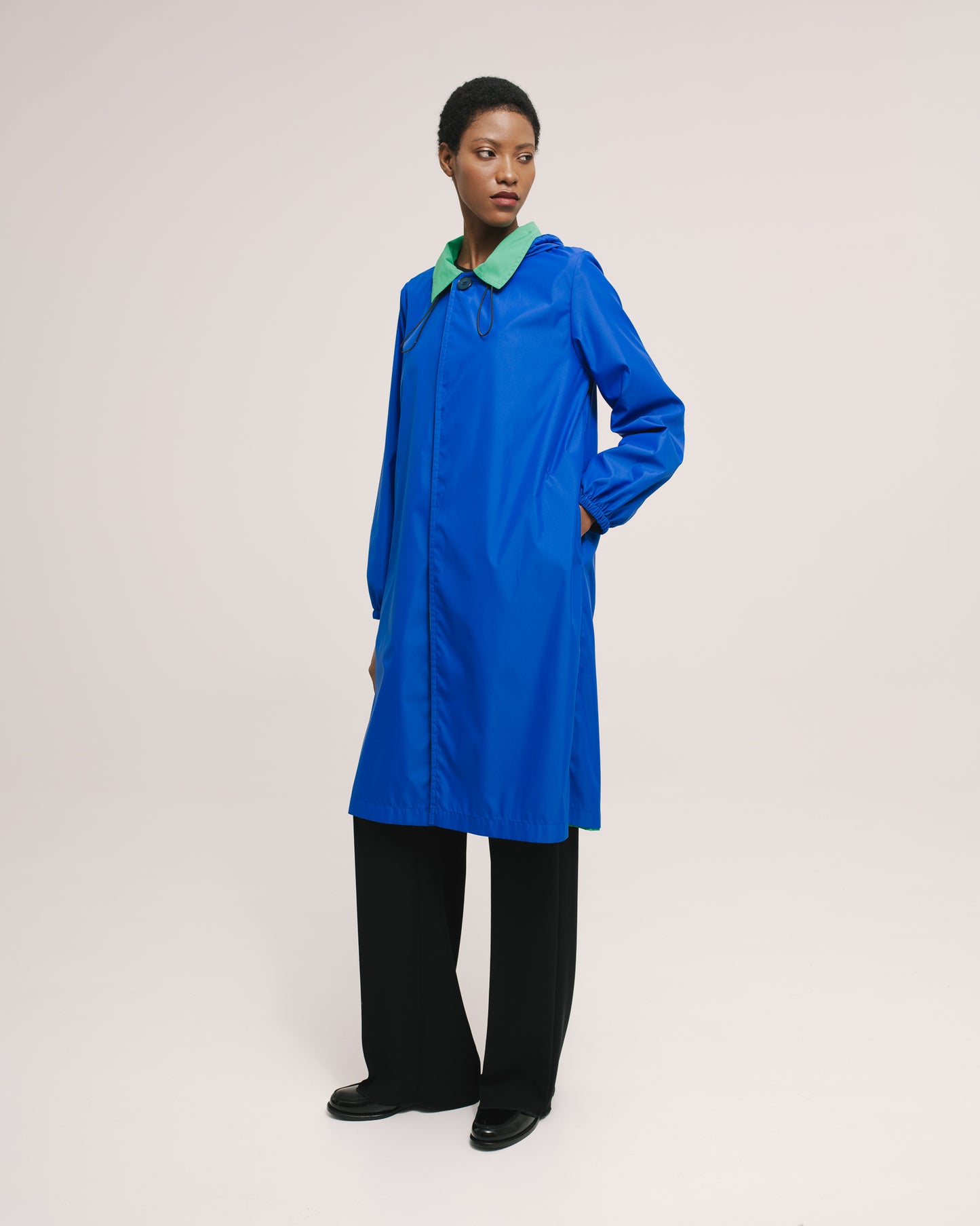 Model wears the Amelia Toro Reversible Double-Face Trench Coat in Blue/Beige, front view