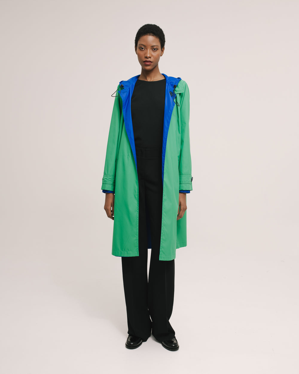 Model wears the Amelia Toro Reversible Double-Face Trench Coat in Blue/Beige, front view