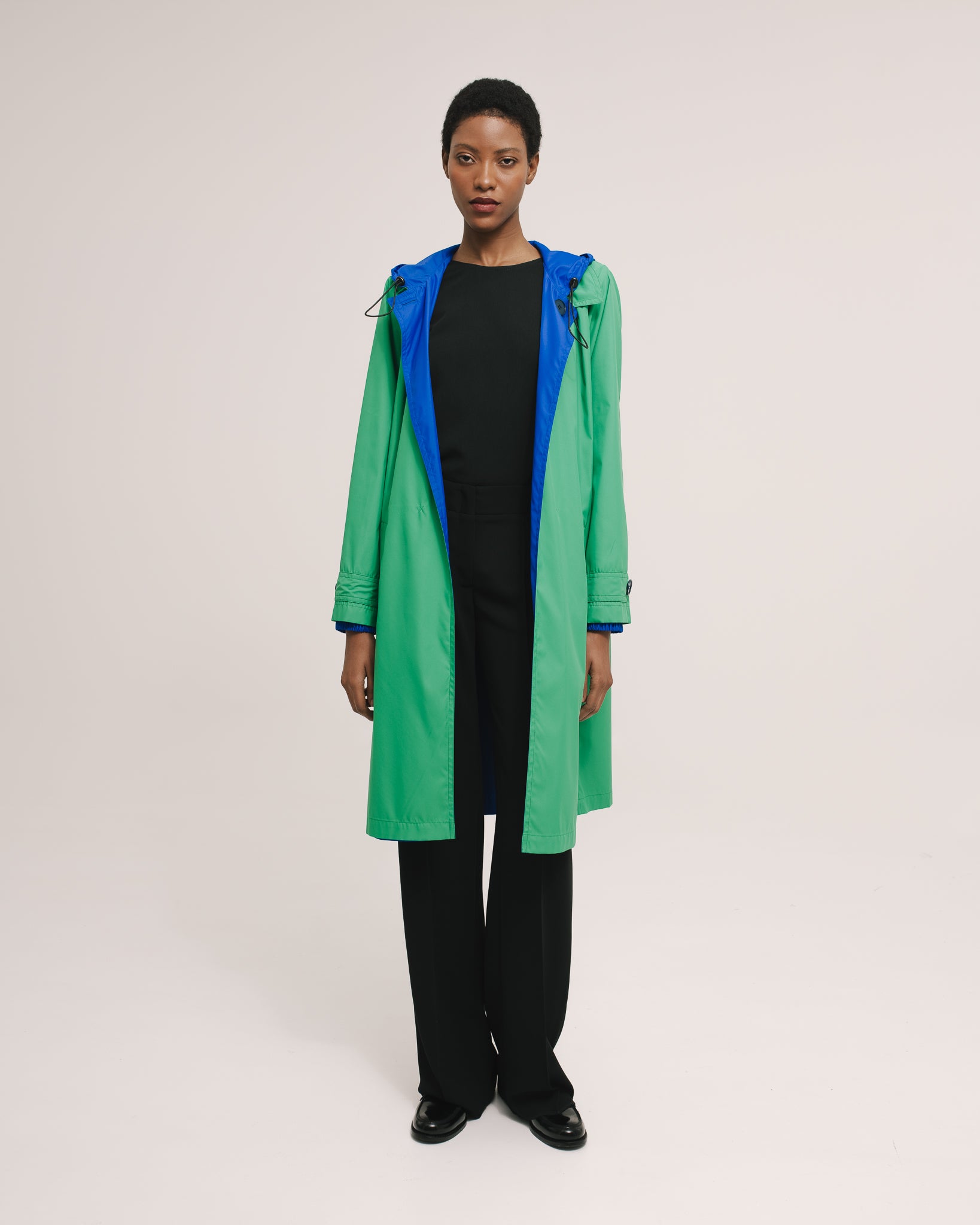 Model wears the Amelia Toro Reversible Double-Face Trench Coat in Blue/Beige, front view