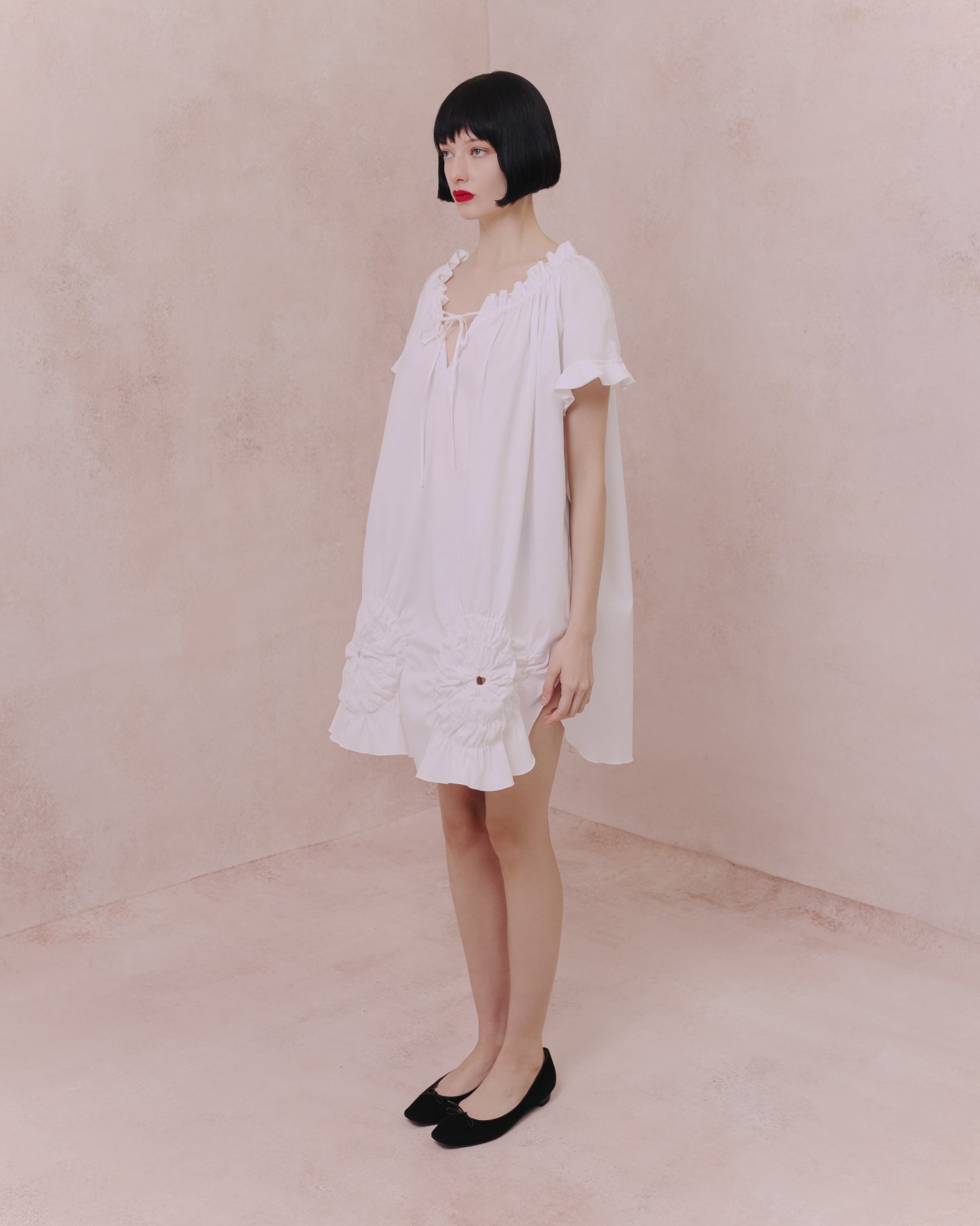 Model wears the Amelia Toro Ruched Cotton Tunic Shirt in blue, front view
