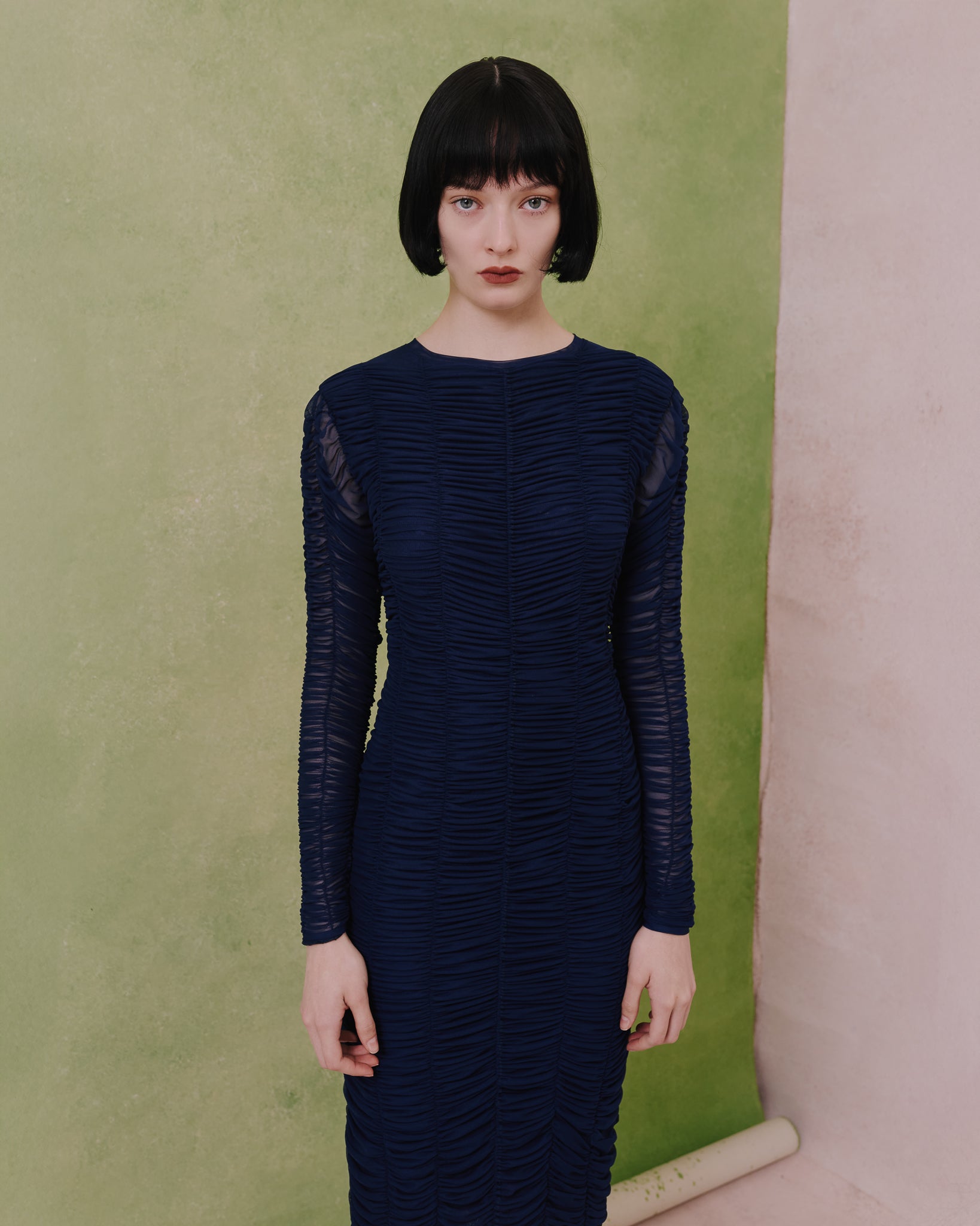 Model wears the Amelia Toro Ruched Tulle Midi Dress in blue, front view