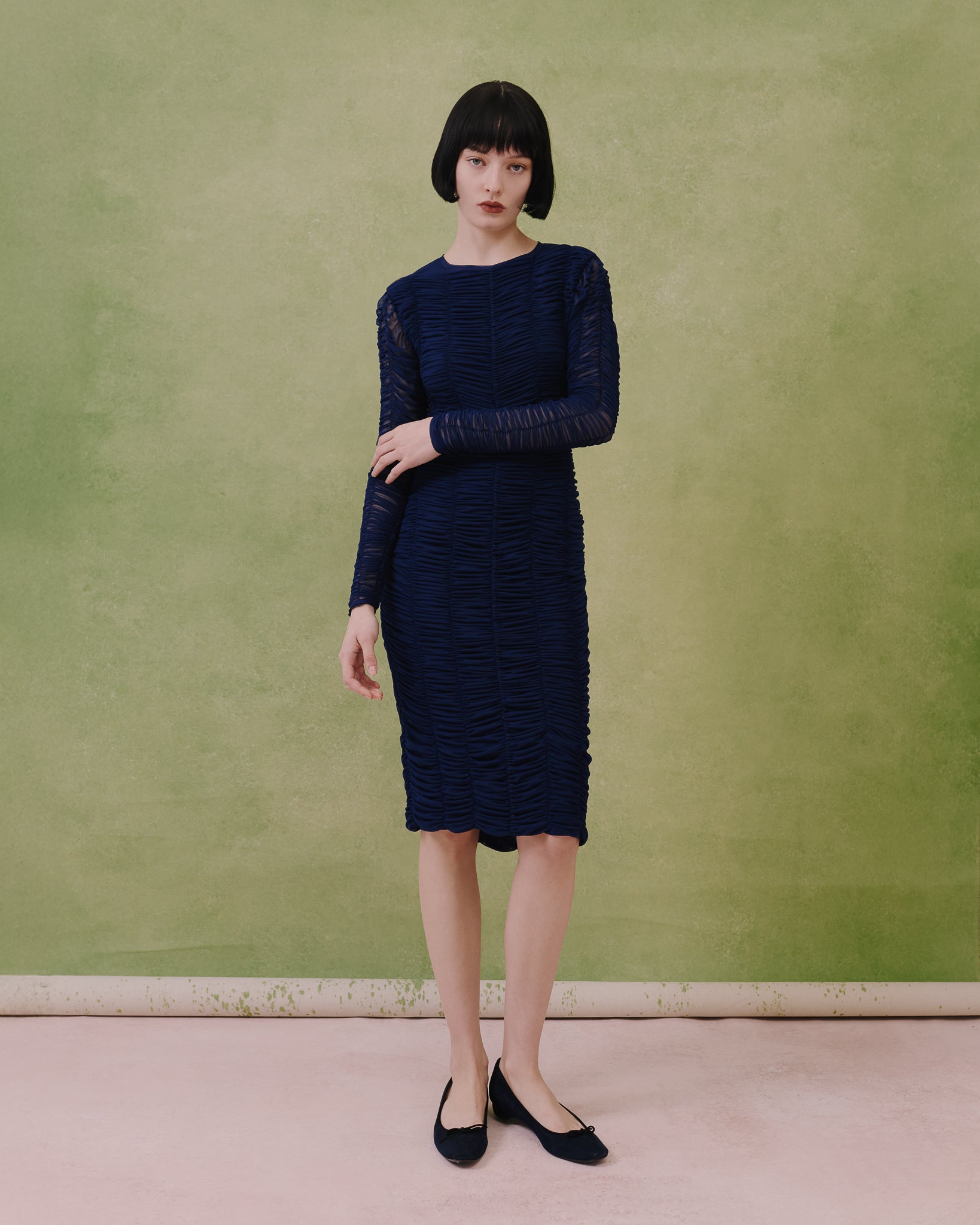 Model wears the Amelia Toro Ruched Tulle Midi Dress in blue, front view