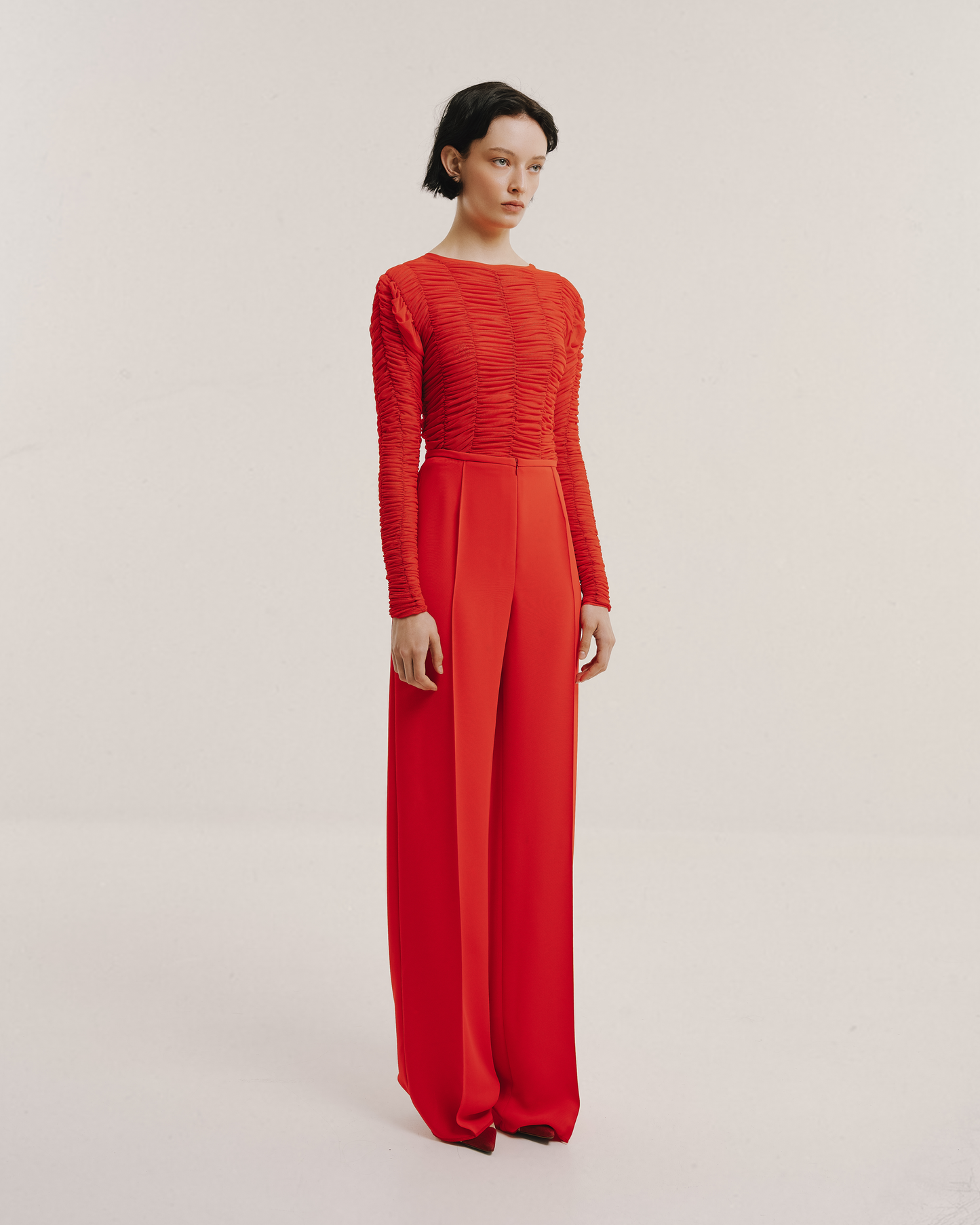 Model wears the Amelia Toro Ruched Tulle Round-Neck Top in blue, front view