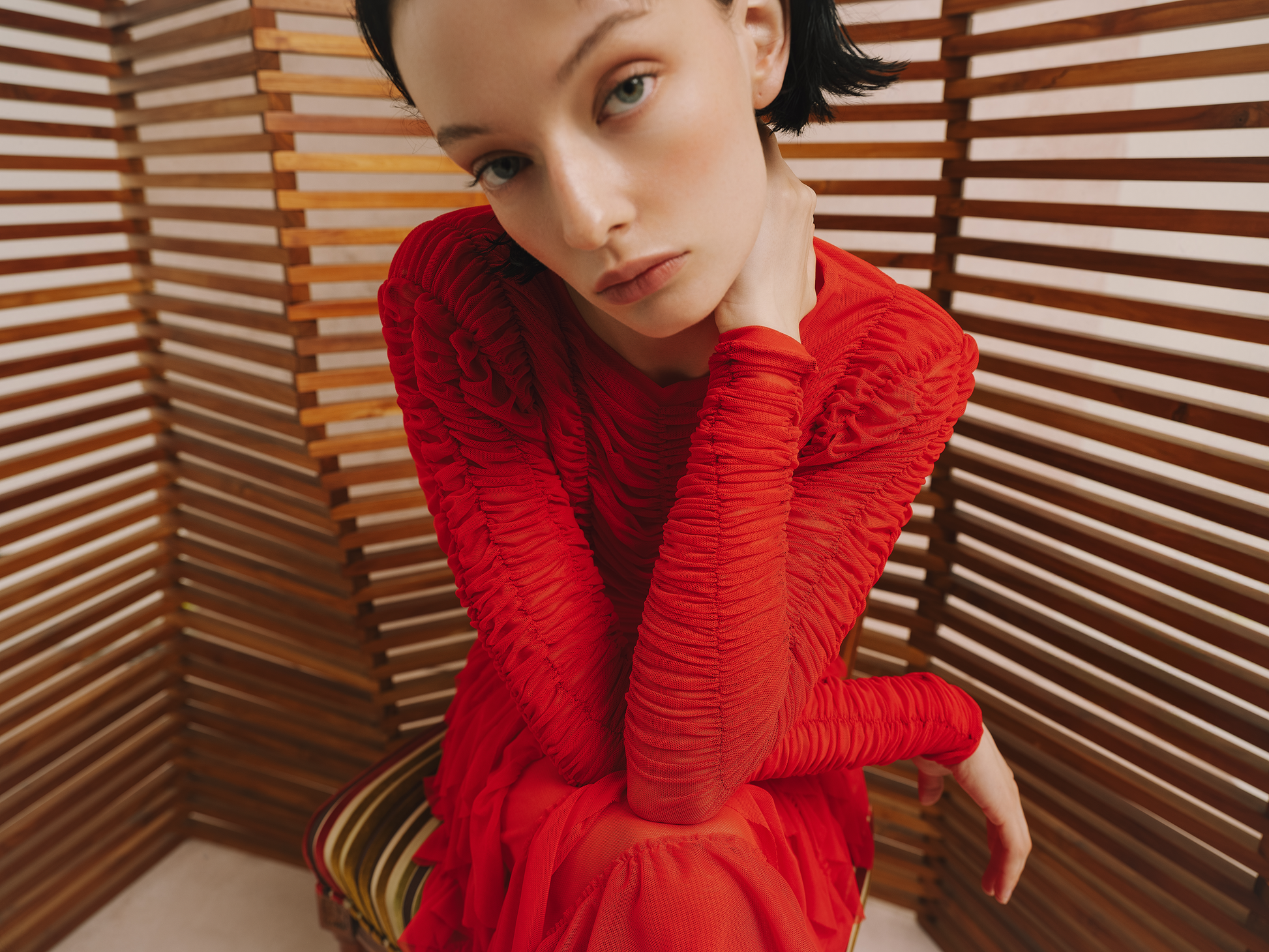 Model wears the Amelia Toro Ruched Tulle Round-Neck Top in blue, front view