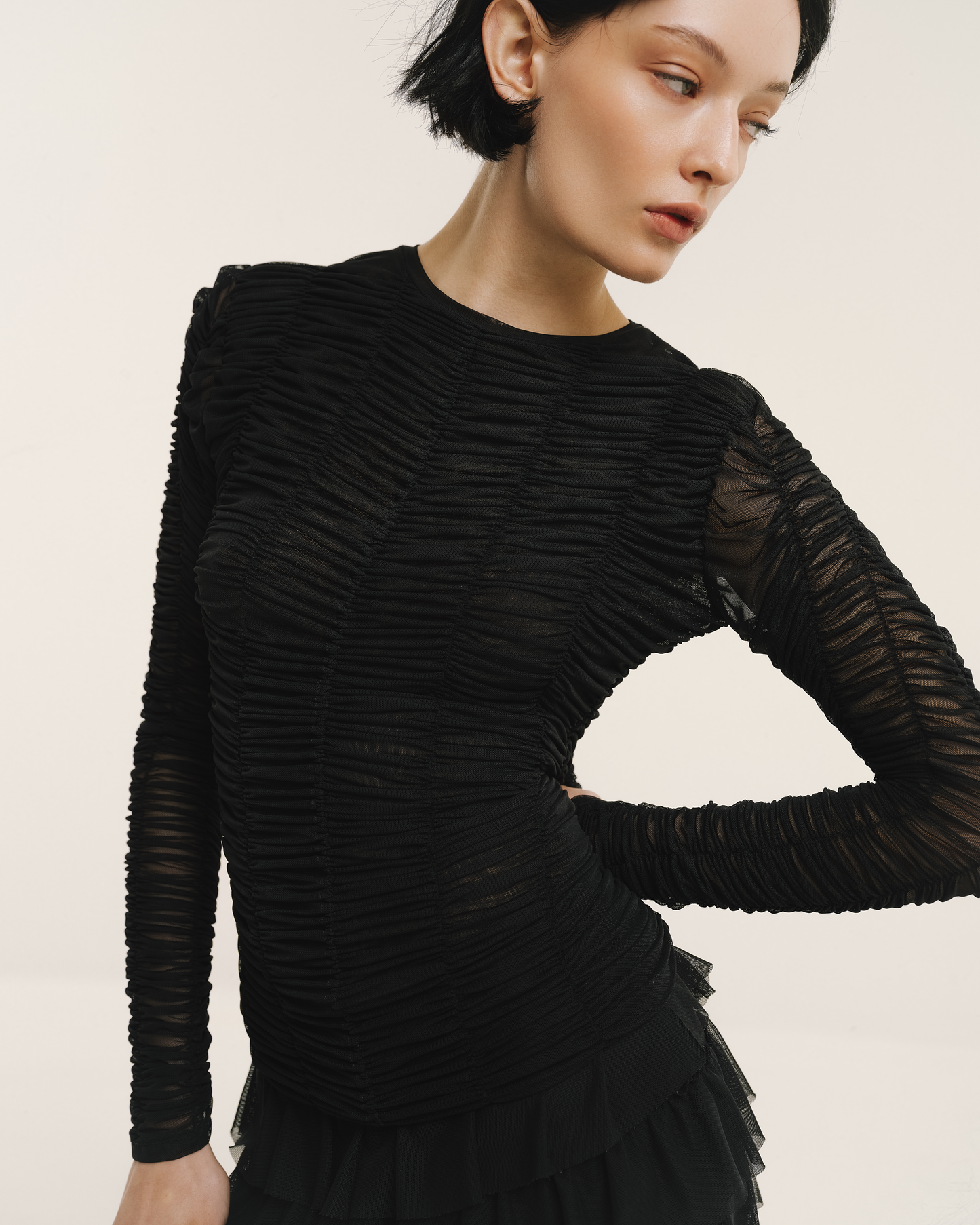 Model wears the Amelia Toro Ruched Tulle Round-Neck Top in red, front view