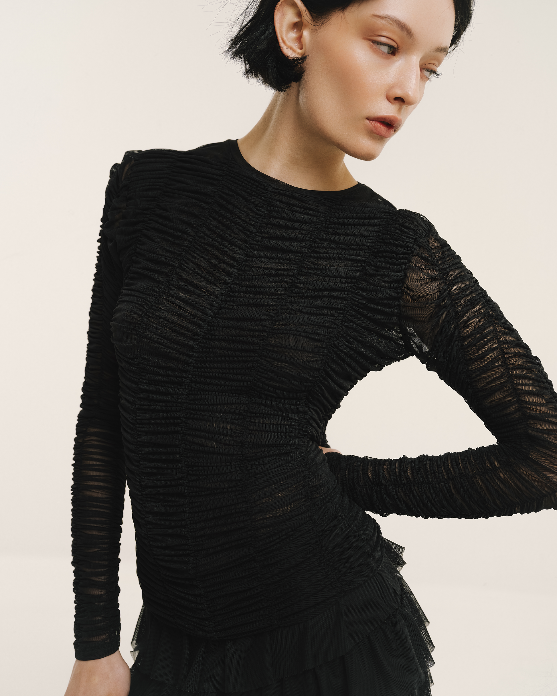 Model wears the Amelia Toro Ruched Tulle Round-Neck Top in red, front view