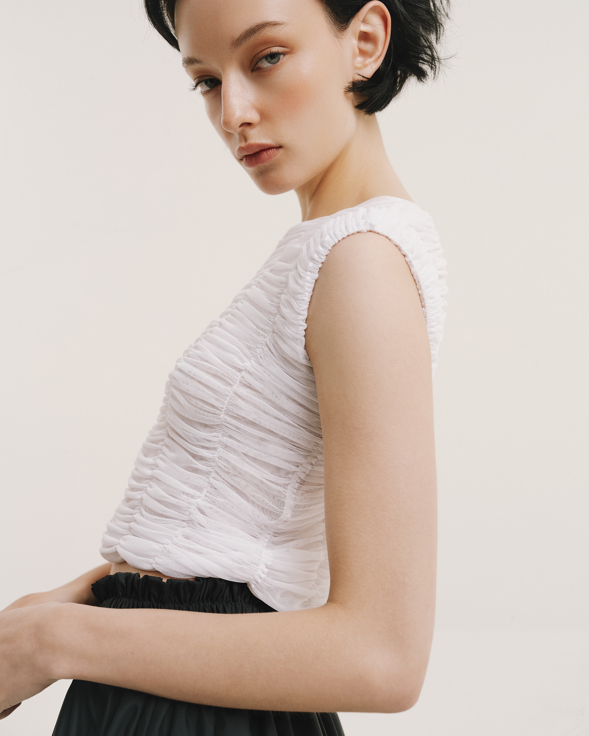 Close-up of the Amelia Toro ruched tulle sleeveless top in white