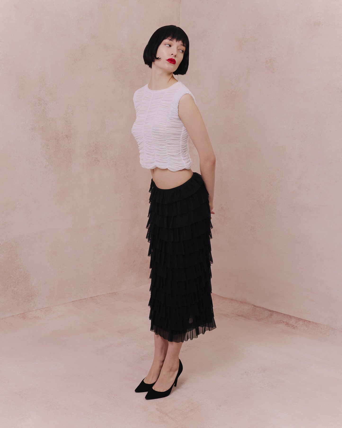 Full-length view of the Amelia Toro ruched tulle sleeveless top in white