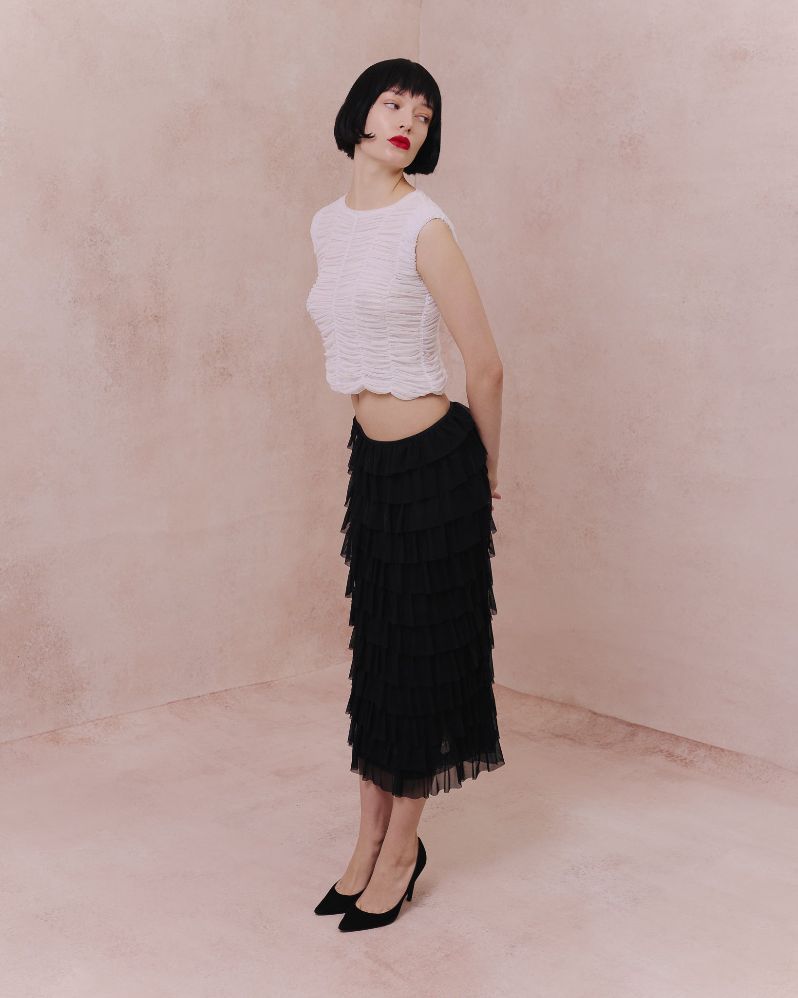 Full-length view of the Amelia Toro ruched tulle sleeveless top in white
