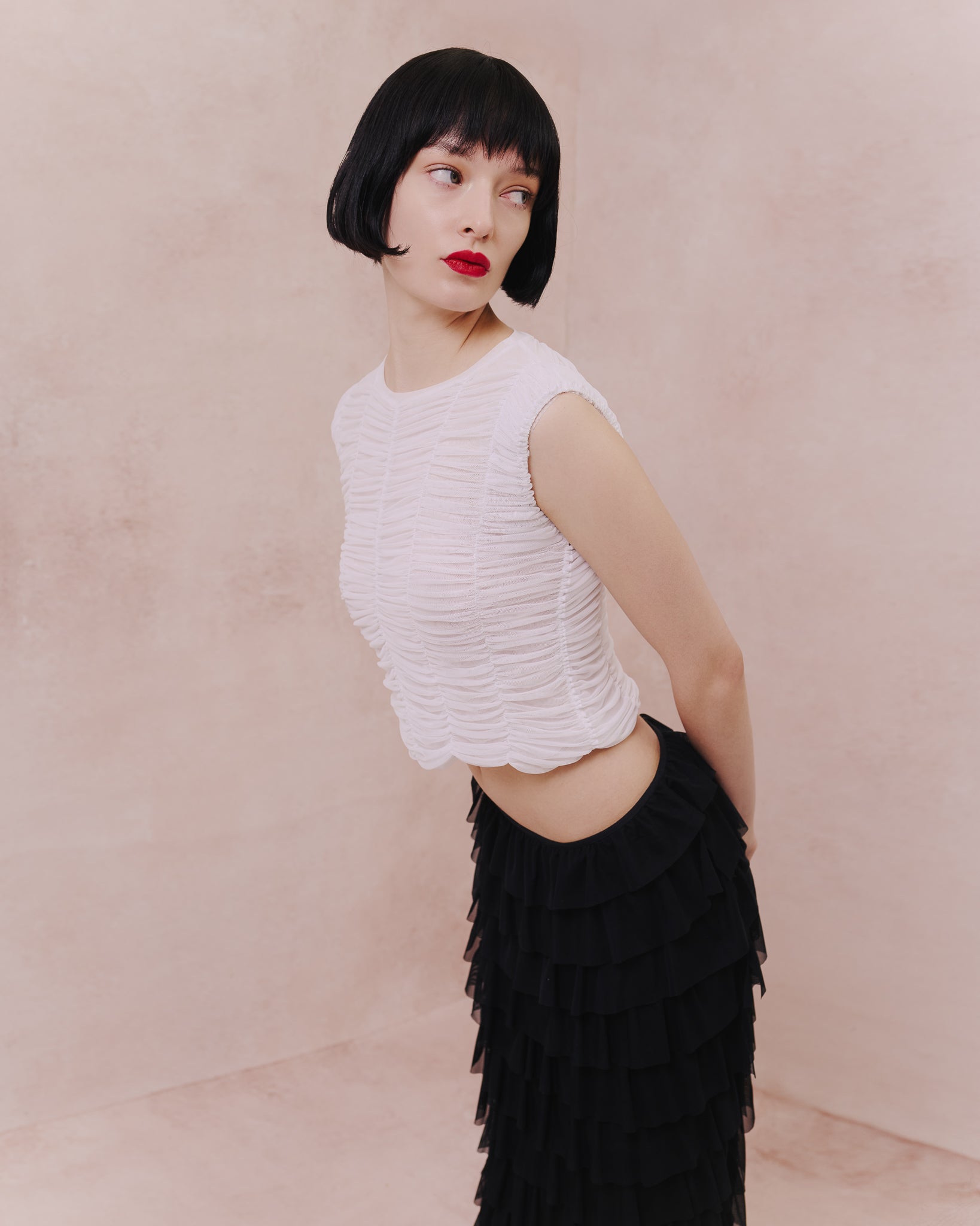 Side view of the Amelia Toro ruched tulle sleeveless top in white