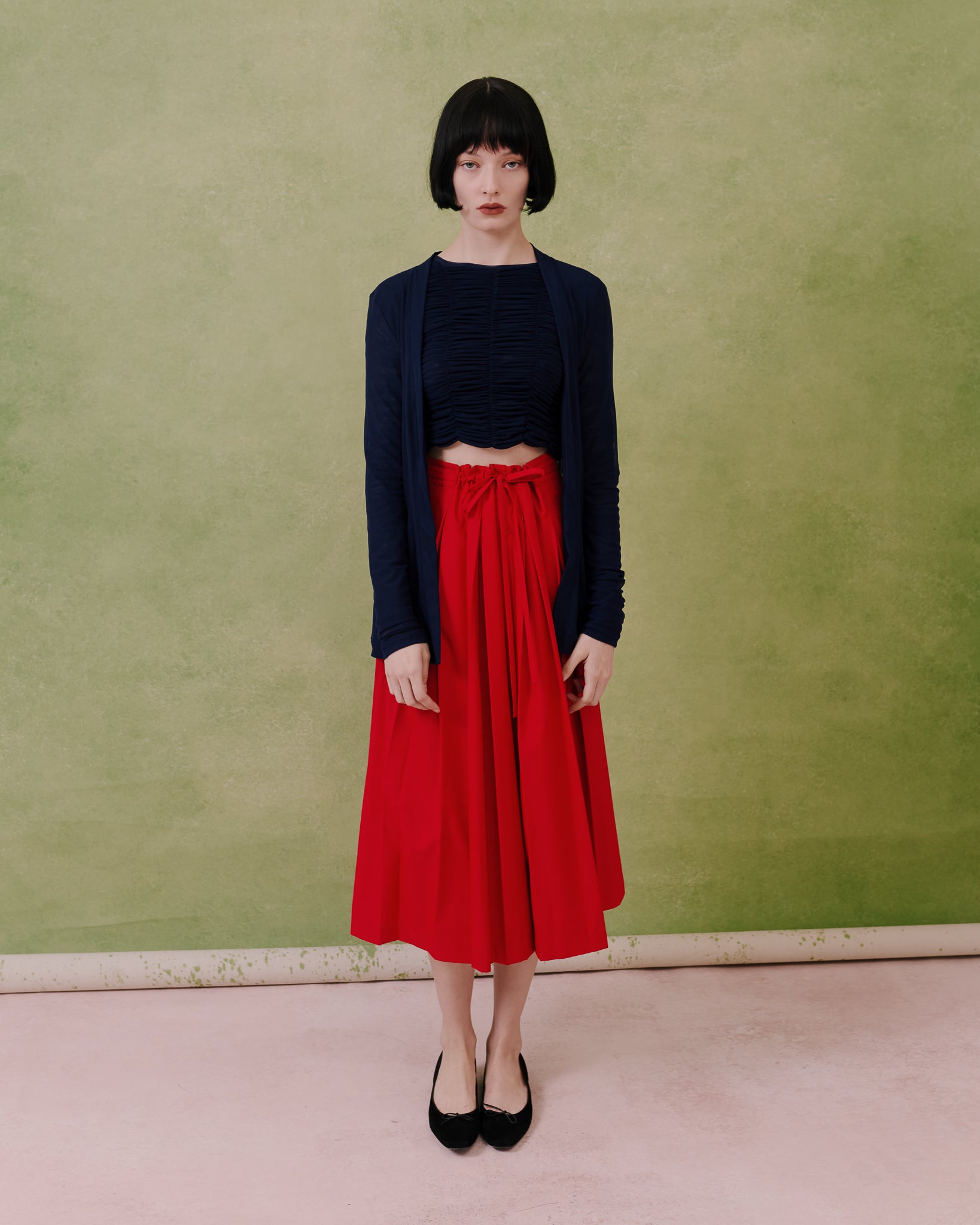 Model wears the Amelia Toro Sheer Tulle Longsleeve Sweater in blue, front view