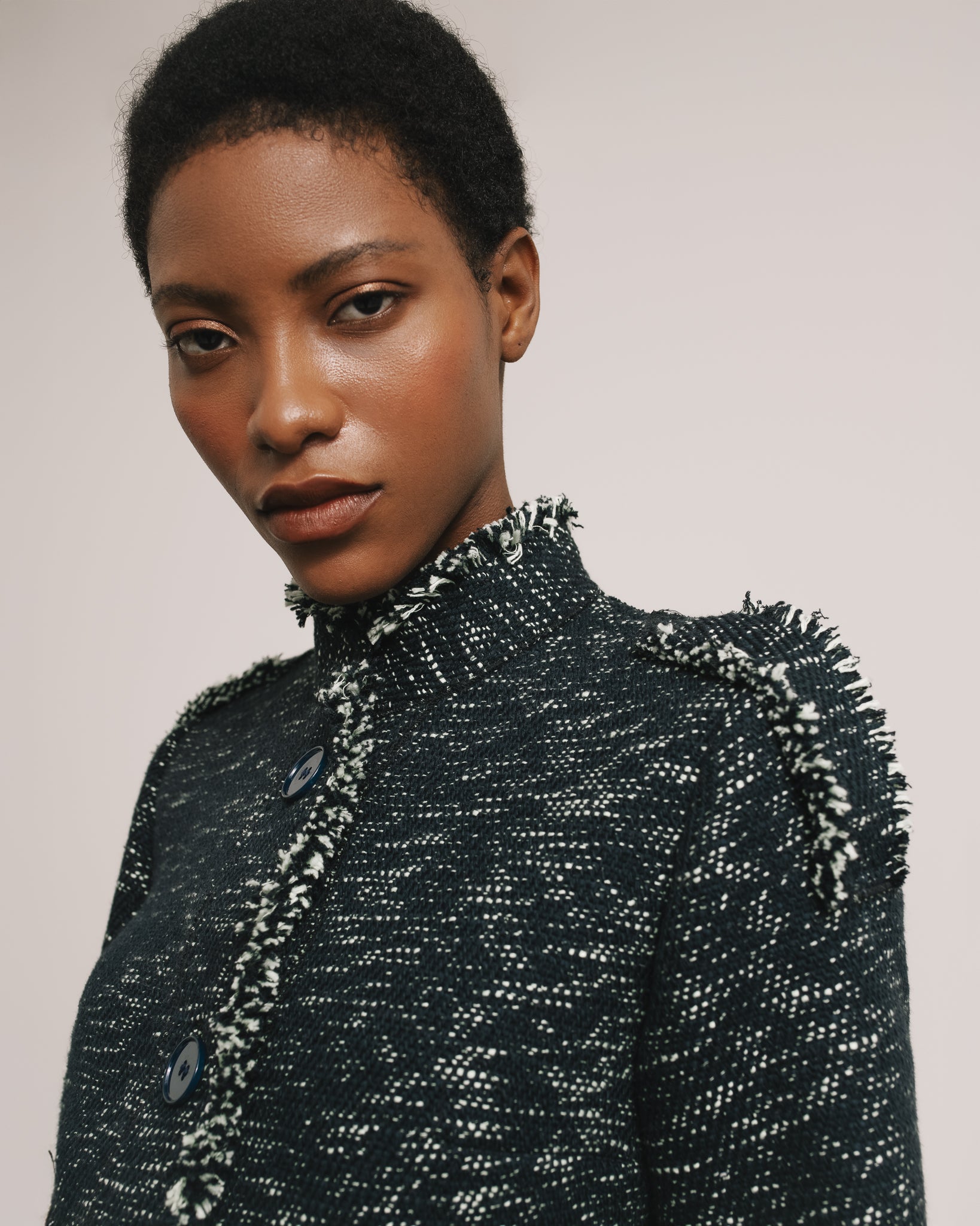 Model wears the Amelia Toro Single-Breasted Cotton Jacket with Epaulettes in Navy Mint, front view
