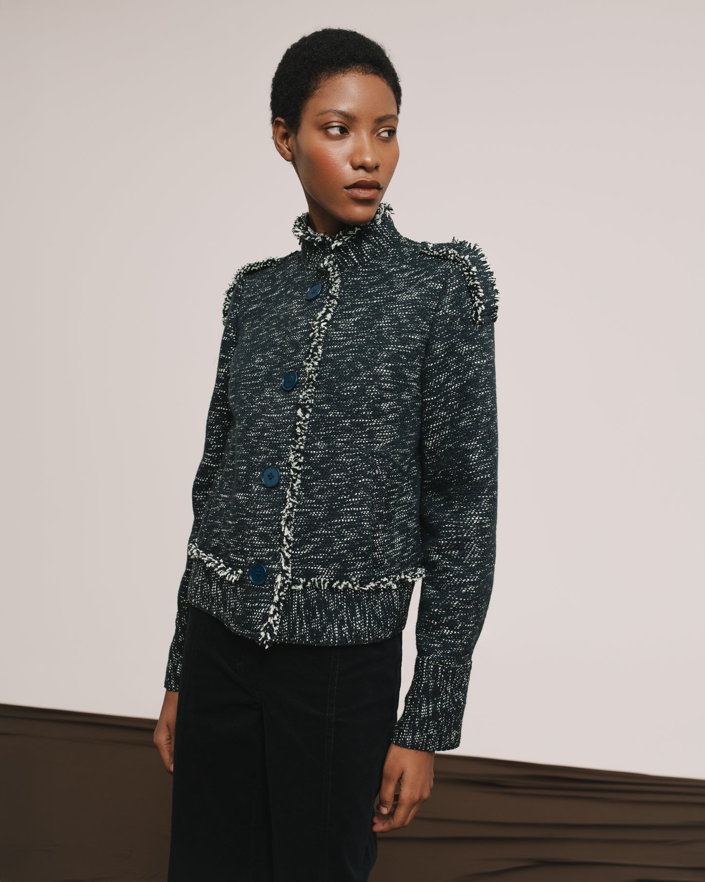 Model wears the Amelia Toro Single-Breasted Cotton Jacket with Epaulettes in Navy Mint, front view