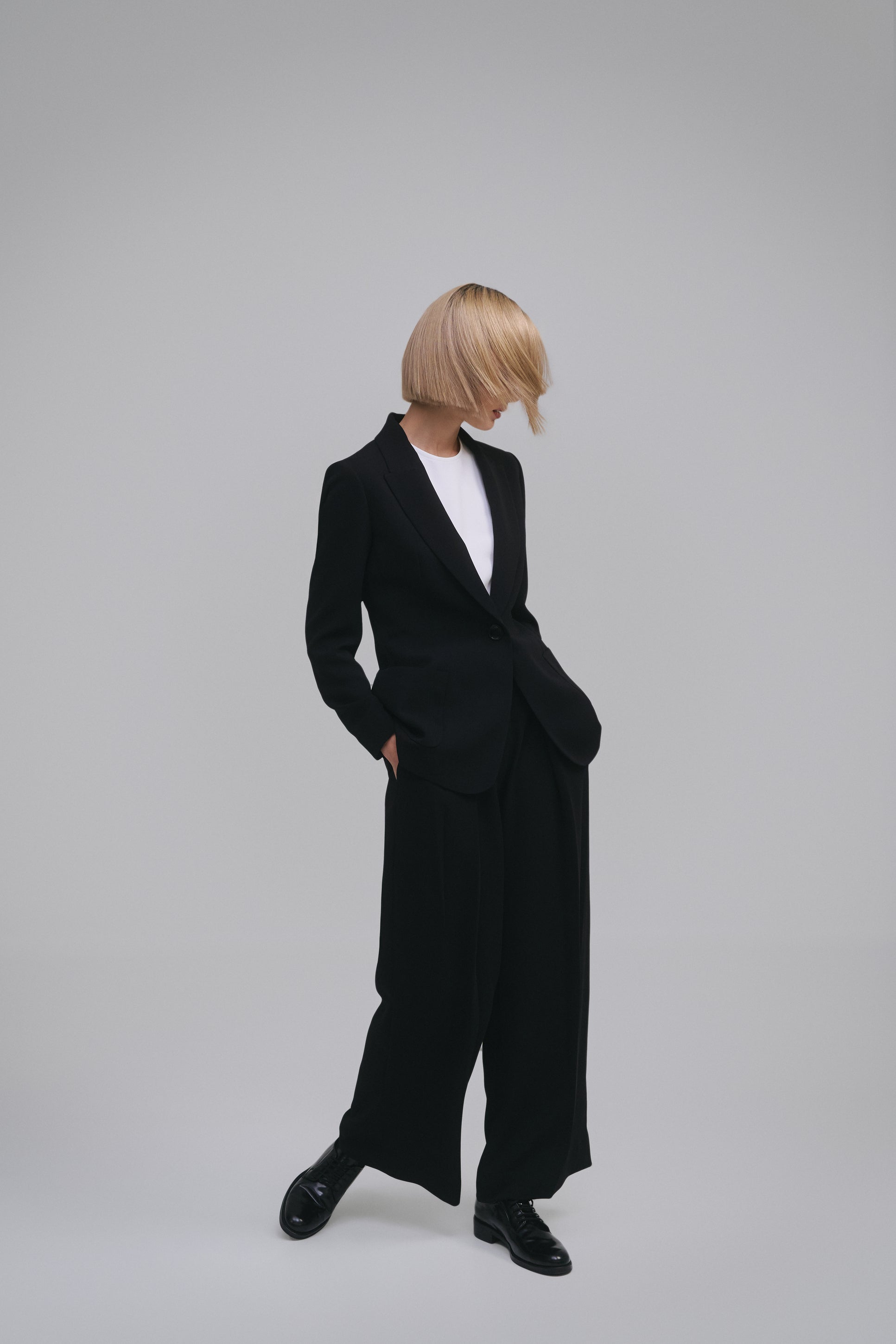 Model wears the Amelia Toro Single-Breasted Tailored Blazer in Black, front view