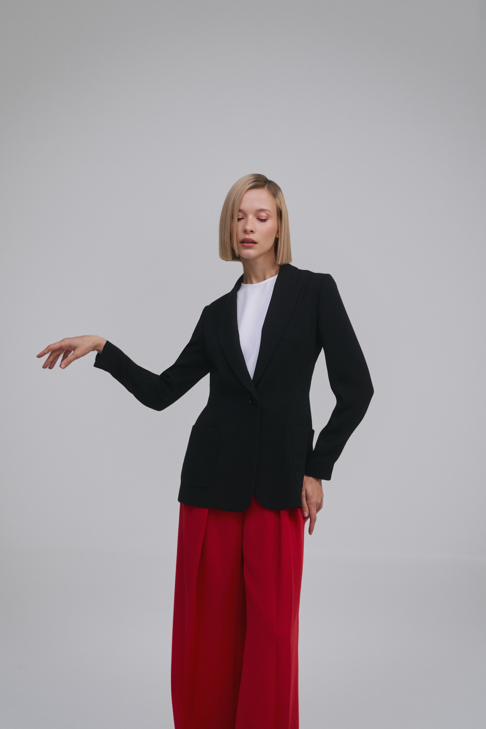 Model wears the Amelia Toro Single-Breasted Tailored Blazer in Black, front view