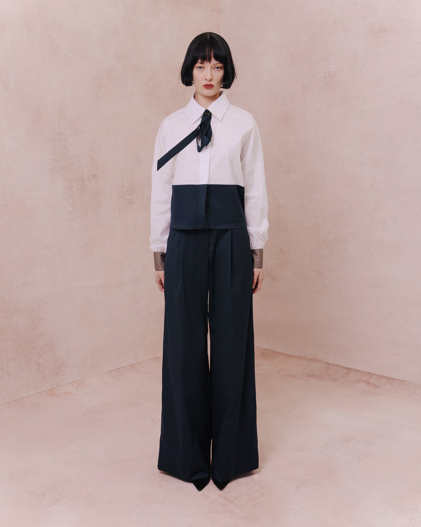 Model wears the Amelia Toro Two-Tone Tailored Shirt in blue/white, front view