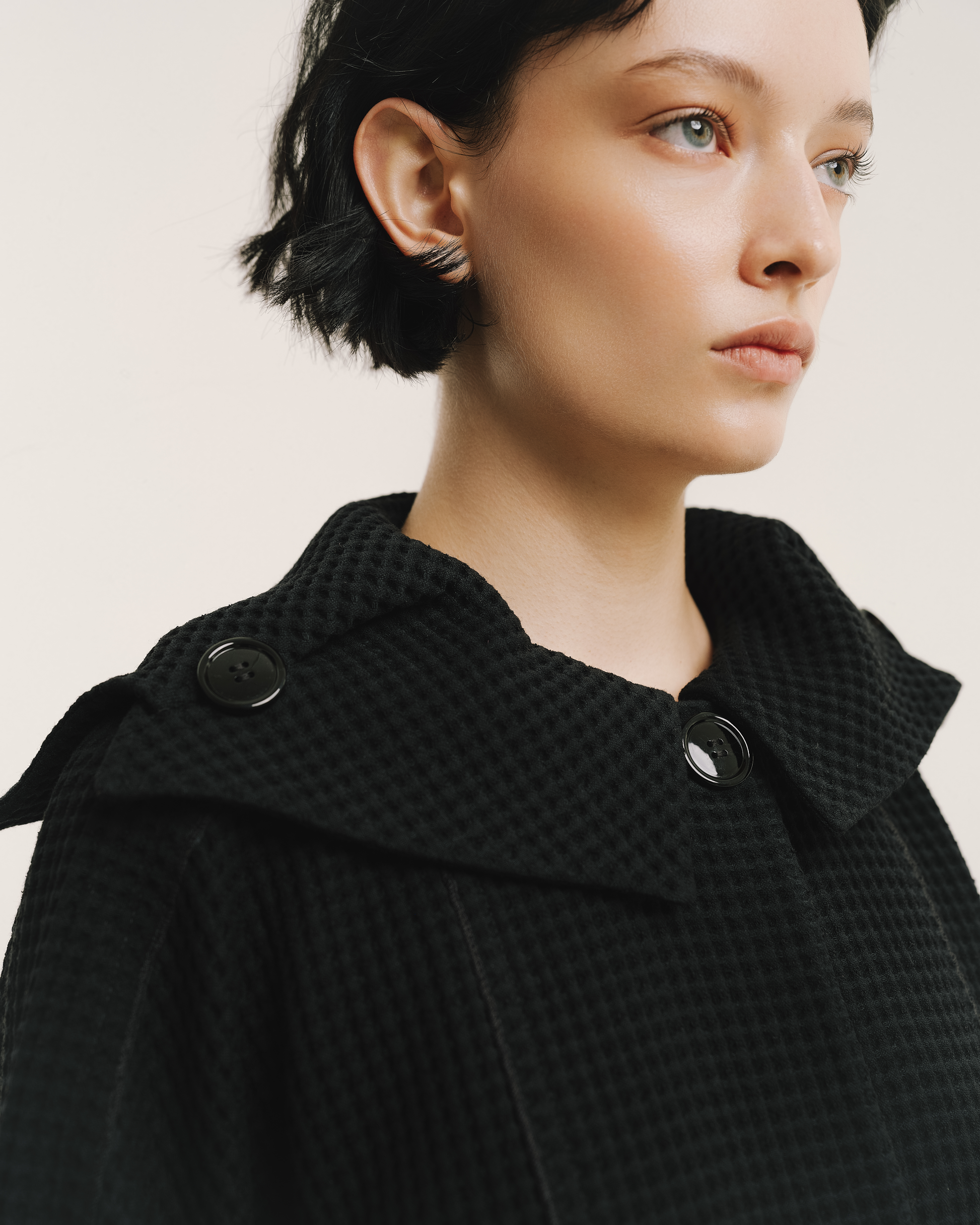Model wears the Amelia Toro Waffle Lightweight Wool Sailor Coat in black, front view